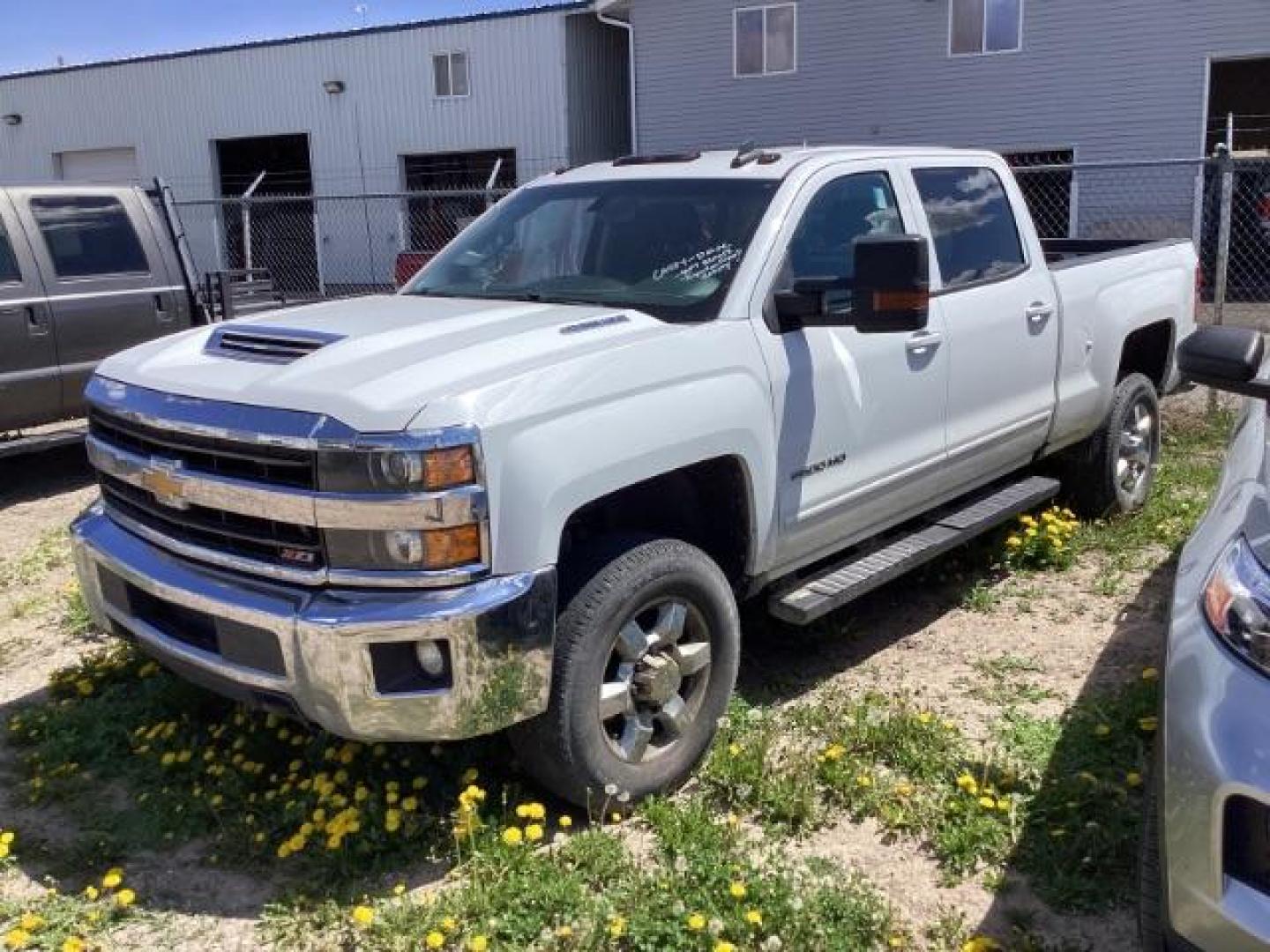 2018 Summit White Chevrolet Silverado 2500HD LT Crew Cab Long Box 4WD (1GC1KVEY6JF) with an 6.6L V8 OHV 32V TURBO DIESEL engine, 6-Speed Automatic transmission, located at 1235 N Woodruff Ave., Idaho Falls, 83401, (208) 523-1053, 43.507172, -112.000488 - Photo#0