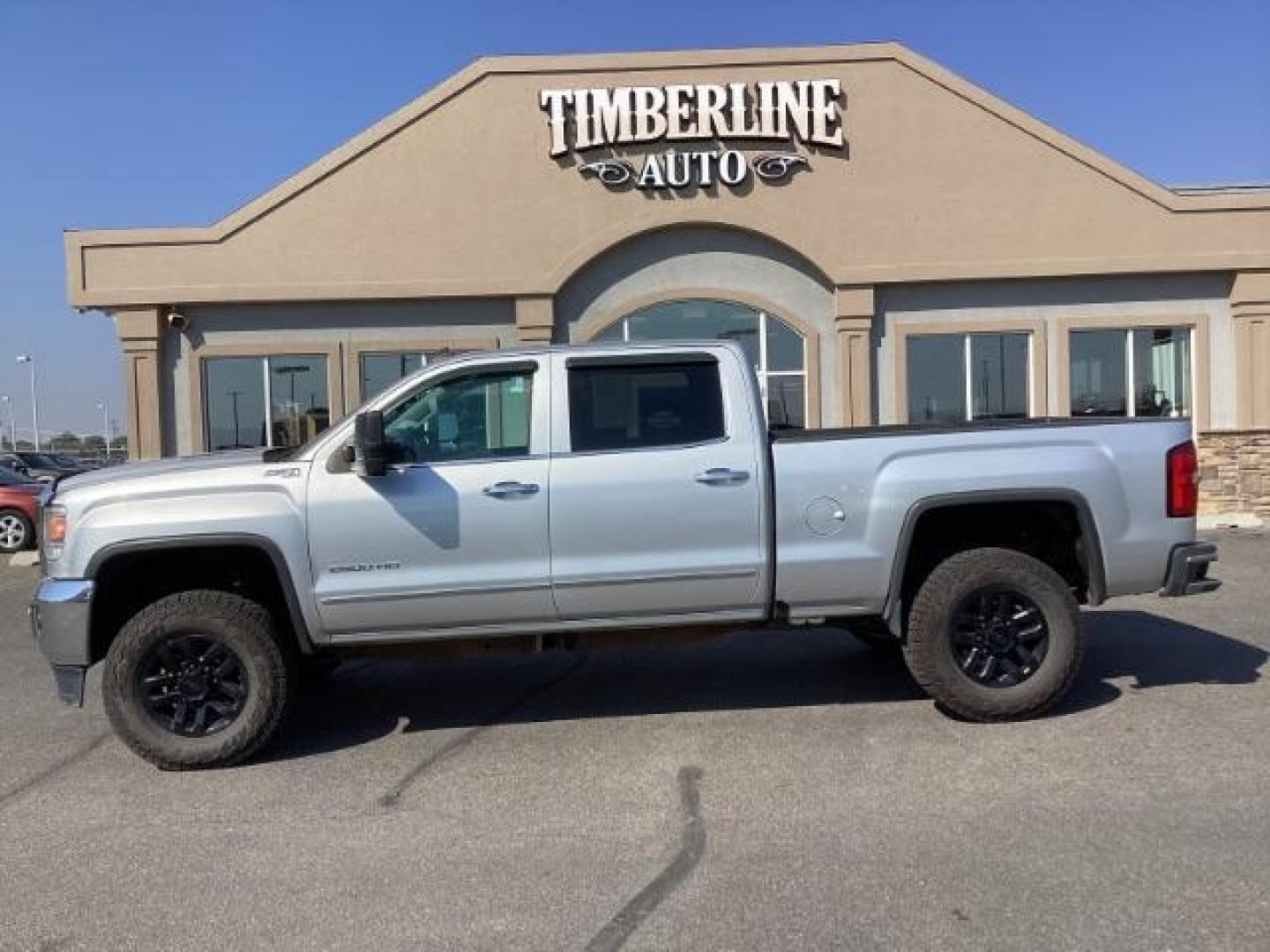 2015 Quicksilver Metallic /Jet Black GMC Sierra 2500HD SLT Crew Cab 4WD (1GT12ZE88FF) with an 6.6L V8 OHV 16V DIESEL engine, 6-Speed Automatic transmission, located at 1235 N Woodruff Ave., Idaho Falls, 83401, (208) 523-1053, 43.507172, -112.000488 - Photo#2