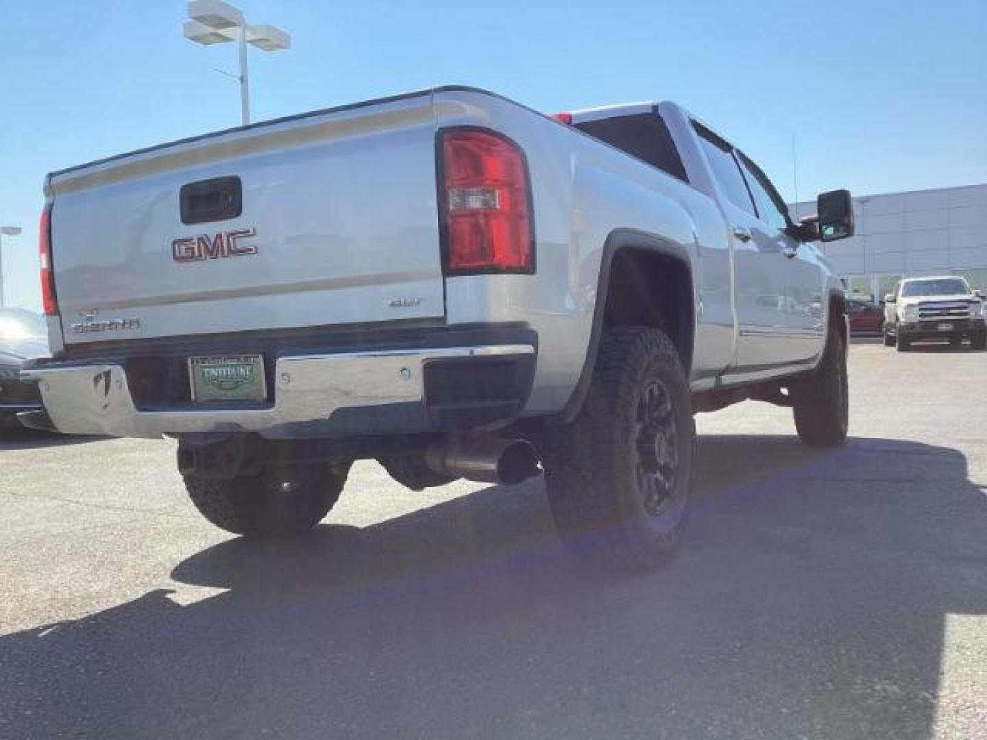 2015 Quicksilver Metallic /Jet Black GMC Sierra 2500HD SLT Crew Cab 4WD (1GT12ZE88FF) with an 6.6L V8 OHV 16V DIESEL engine, 6-Speed Automatic transmission, located at 1235 N Woodruff Ave., Idaho Falls, 83401, (208) 523-1053, 43.507172, -112.000488 - Photo#5