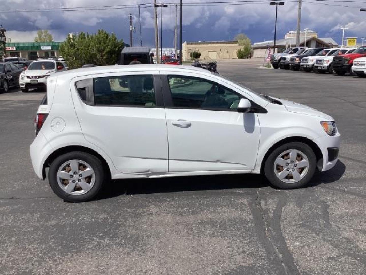 2016 Summit White Chevrolet Sonic LS Auto 5-Door (1G1JA6SH6G4) with an 1.8L L4 DOHC 24V engine, 6-Speed Automatic transmission, located at 1235 N Woodruff Ave., Idaho Falls, 83401, (208) 523-1053, 43.507172, -112.000488 - The 2016 Chevy Sonic LS is a compact car known for its fuel efficiency, nimble handling, and decent amount of standard features. Here's an overview of its key features: Engine Options: The Sonic LS typically comes with a 1.8-liter four-cylinder engine, although some models may have a turbocharged 1 - Photo#5