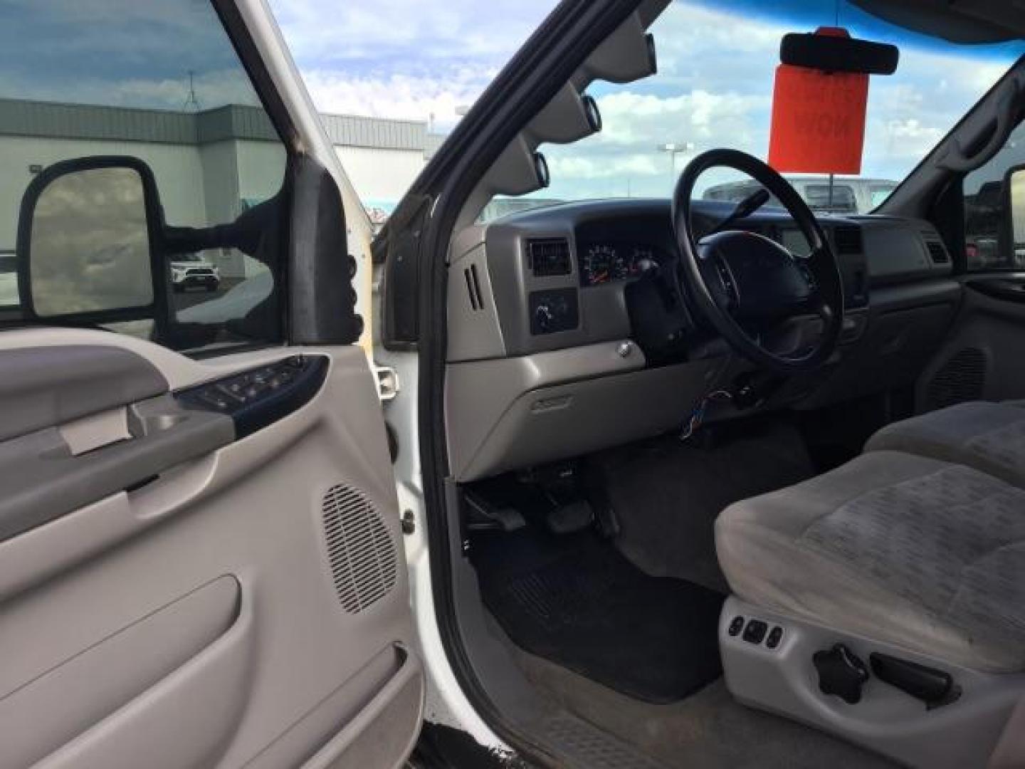 1999 Oxford White Clearcoat /Medium Graphite Cloth Ford F-250 SD XLT Crew Cab SWB 4WD (1FTNW21F4XE) with an 7.3L V8 OHV 16V TURBO DIESEL engine, 4-Speed Automatic transmission, located at 1235 N Woodruff Ave., Idaho Falls, 83401, (208) 523-1053, 43.507172, -112.000488 - This F-250 7.3L Powertstroke runs and drives very well! The body and paint are in good shape and the interior is in great condition! The tires are near new with 90% plus tread left. Your new pre-owned Ford diesel has a spray in bed liner, aftermarket trailer brake installed, 'A' pillar gauge pods, a - Photo#10