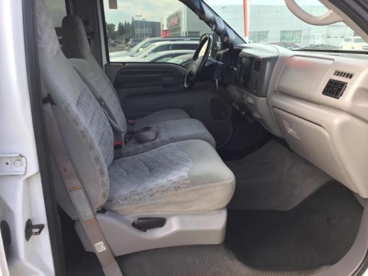 1999 Oxford White Clearcoat /Medium Graphite Cloth Ford F-250 SD XLT Crew Cab SWB 4WD (1FTNW21F4XE) with an 7.3L V8 OHV 16V TURBO DIESEL engine, 4-Speed Automatic transmission, located at 1235 N Woodruff Ave., Idaho Falls, 83401, (208) 523-1053, 43.507172, -112.000488 - This F-250 7.3L Powertstroke runs and drives very well! The body and paint are in good shape and the interior is in great condition! The tires are near new with 90% plus tread left. Your new pre-owned Ford diesel has a spray in bed liner, aftermarket trailer brake installed, 'A' pillar gauge pods, a - Photo#18