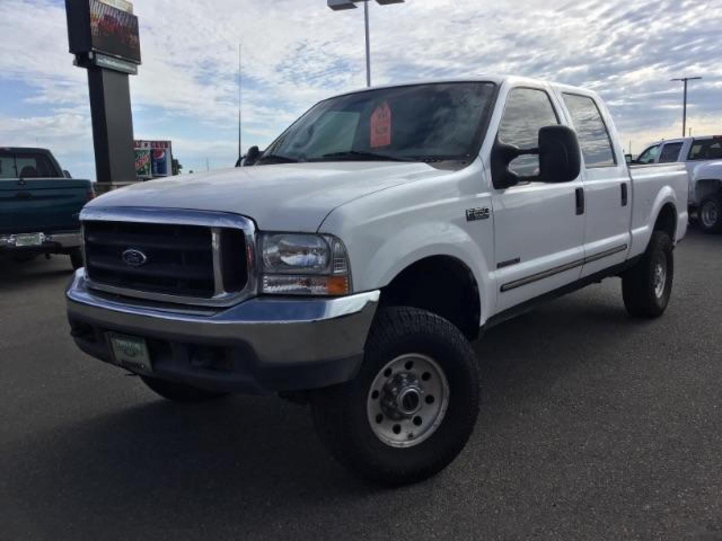 1999 Oxford White Clearcoat /Medium Graphite Cloth Ford F-250 SD XLT Crew Cab SWB 4WD (1FTNW21F4XE) with an 7.3L V8 OHV 16V TURBO DIESEL engine, 4-Speed Automatic transmission, located at 1235 N Woodruff Ave., Idaho Falls, 83401, (208) 523-1053, 43.507172, -112.000488 - This F-250 7.3L Powertstroke runs and drives very well! The body and paint are in good shape and the interior is in great condition! The tires are near new with 90% plus tread left. Your new pre-owned Ford diesel has a spray in bed liner, aftermarket trailer brake installed, 'A' pillar gauge pods, a - Photo#1