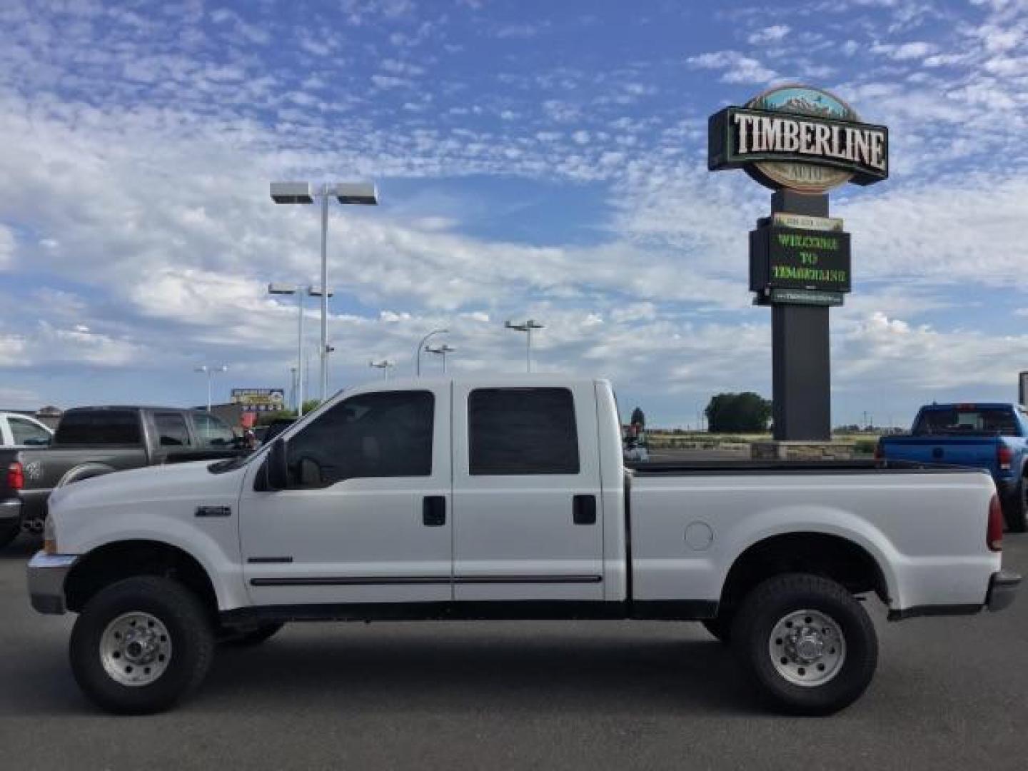 1999 Oxford White Clearcoat /Medium Graphite Cloth Ford F-250 SD XLT Crew Cab SWB 4WD (1FTNW21F4XE) with an 7.3L V8 OHV 16V TURBO DIESEL engine, 4-Speed Automatic transmission, located at 1235 N Woodruff Ave., Idaho Falls, 83401, (208) 523-1053, 43.507172, -112.000488 - This F-250 7.3L Powertstroke runs and drives very well! The body and paint are in good shape and the interior is in great condition! The tires are near new with 90% plus tread left. Your new pre-owned Ford diesel has a spray in bed liner, aftermarket trailer brake installed, 'A' pillar gauge pods, a - Photo#2