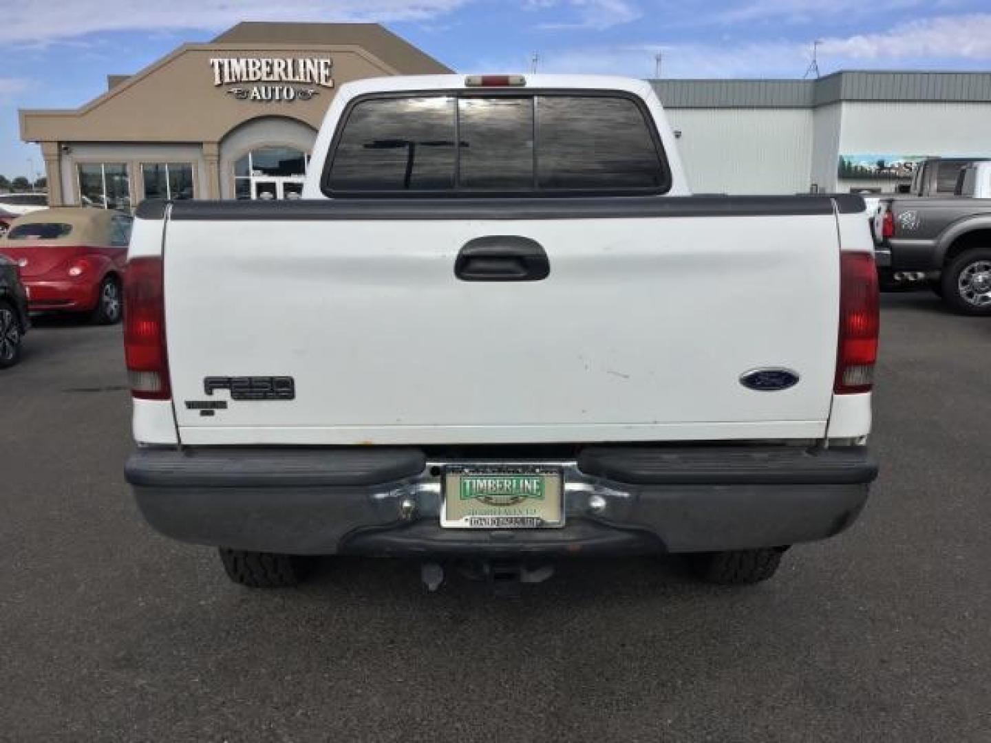 1999 Oxford White Clearcoat /Medium Graphite Cloth Ford F-250 SD XLT Crew Cab SWB 4WD (1FTNW21F4XE) with an 7.3L V8 OHV 16V TURBO DIESEL engine, 4-Speed Automatic transmission, located at 1235 N Woodruff Ave., Idaho Falls, 83401, (208) 523-1053, 43.507172, -112.000488 - This F-250 7.3L Powertstroke runs and drives very well! The body and paint are in good shape and the interior is in great condition! The tires are near new with 90% plus tread left. Your new pre-owned Ford diesel has a spray in bed liner, aftermarket trailer brake installed, 'A' pillar gauge pods, a - Photo#4