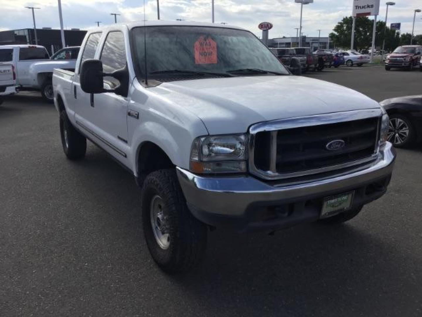 1999 Oxford White Clearcoat /Medium Graphite Cloth Ford F-250 SD XLT Crew Cab SWB 4WD (1FTNW21F4XE) with an 7.3L V8 OHV 16V TURBO DIESEL engine, 4-Speed Automatic transmission, located at 1235 N Woodruff Ave., Idaho Falls, 83401, (208) 523-1053, 43.507172, -112.000488 - This F-250 7.3L Powertstroke runs and drives very well! The body and paint are in good shape and the interior is in great condition! The tires are near new with 90% plus tread left. Your new pre-owned Ford diesel has a spray in bed liner, aftermarket trailer brake installed, 'A' pillar gauge pods, a - Photo#7