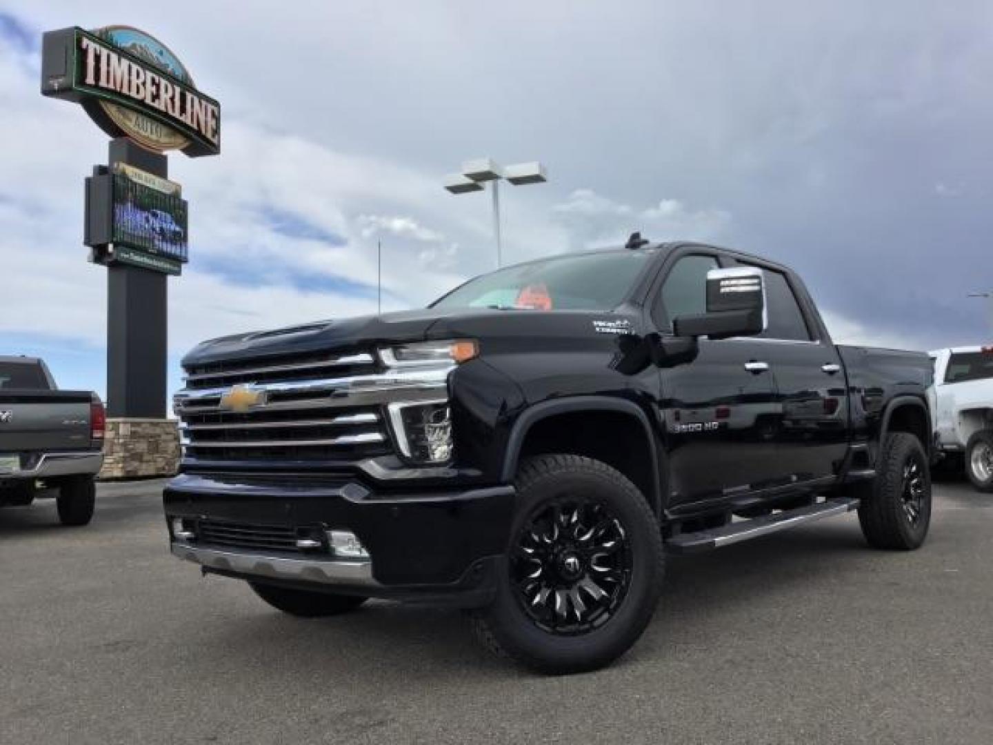 2022 Black /Jet Black Chevrolet Silverado 3500HD High Country Crew Cab 4WD (1GC4YVEY5NF) with an 6.6L V8 OHV 32V TURBO DIESEL engine, 6-Speed Automatic transmission, located at 1235 N Woodruff Ave., Idaho Falls, 83401, (208) 523-1053, 43.507172, -112.000488 - 2022 Chevrolet Silverado 3500HD High Country, 6.6L Duramax turbo diesel! This truck comes with aftermarket 20 inch FUEL BLITZ wheels wrapped in near new DYNAPRO AT2 tires. At Timberline Auto it is always easy to find a great deal on your next vehicle! Our experienced sales staff can help find the r - Photo#0