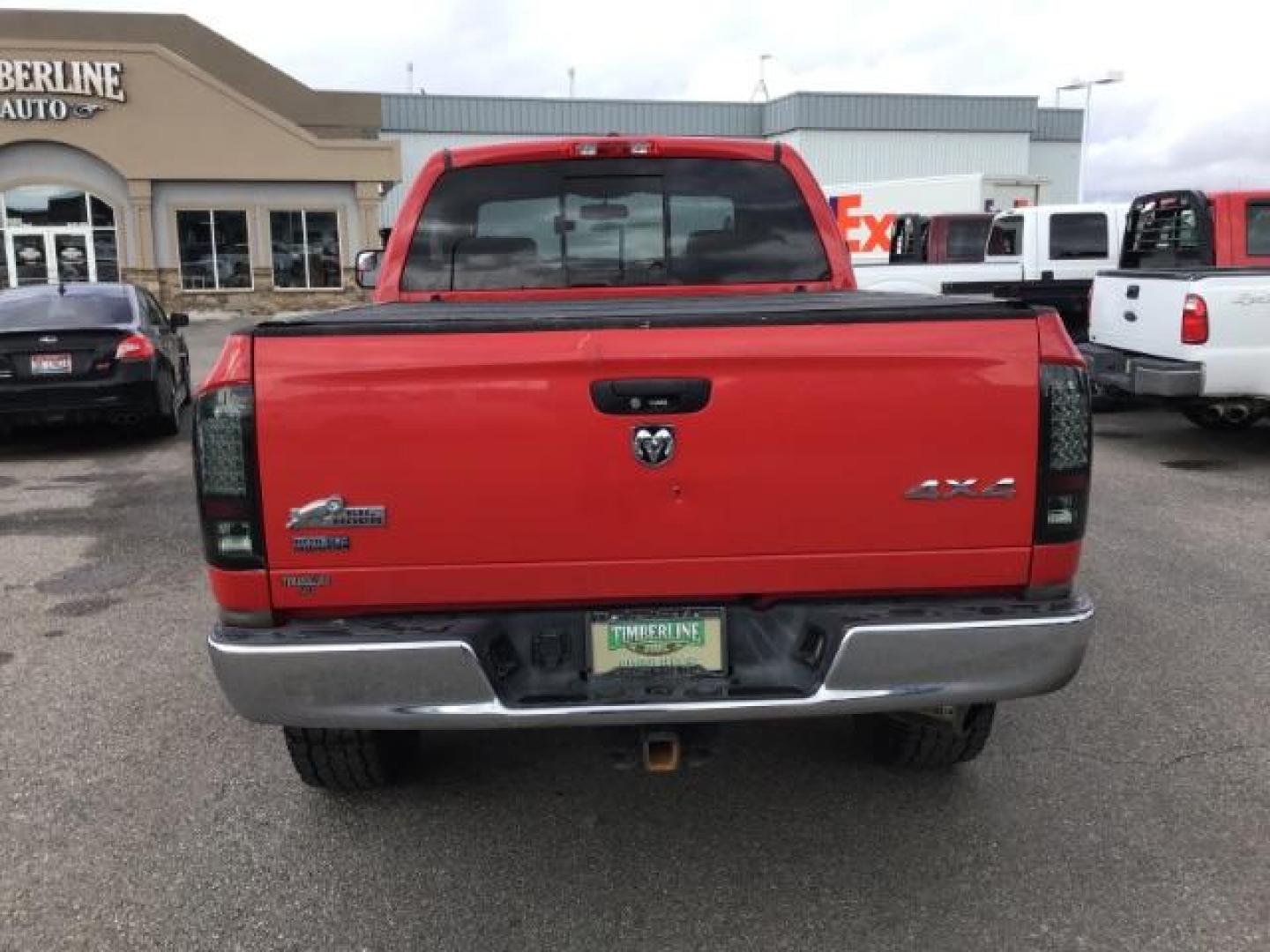 2009 Inferno Red Crystal Pearl Coat /Medium Slate Gray Cloth Interior Dodge Ram 2500 SLT Quad Cab SWB 4WD (3D7KS28L89G) with an 6.7L L6 OHV 24V TURBO DIESEL engine, 5-Speed Automatic transmission, located at 1235 N Woodruff Ave., Idaho Falls, 83401, (208) 523-1053, 43.507172, -112.000488 - This 2009 Dodge 2500 Bighorn 4x4, has the 6.7L diesel motor. It has 132,000 miles. Comes with cloth interior, power seat, keyless remote, power windows and locks, spray in bedliner, and AM/FM CD stereo. At Timberline Auto it is always easy to find a great deal on your next vehicle! Our experienced s - Photo#3