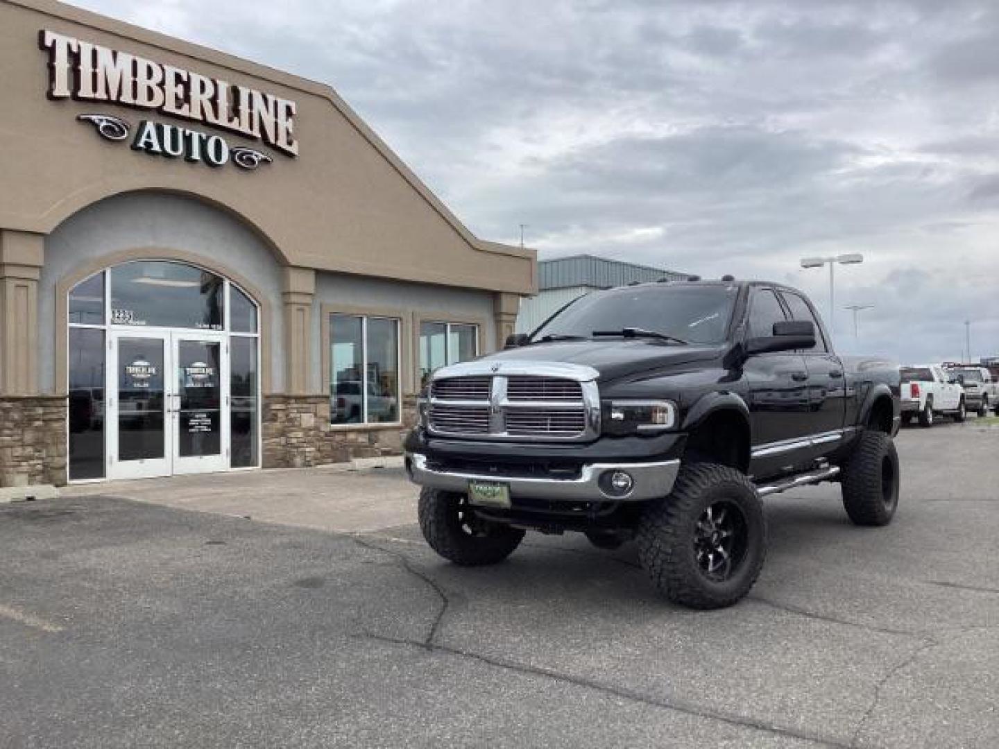 2004 Black /Dark Slate Gray Leather Interior Dodge Ram 2500 Laramie Quad Cab 4WD (3D7KU28C44G) with an 5.9L L6 OHV 24V TURBO DIESEL engine, 5-Speed Manual transmission, located at 1235 N Woodruff Ave., Idaho Falls, 83401, (208) 523-1053, 43.507172, -112.000488 - Photo#0