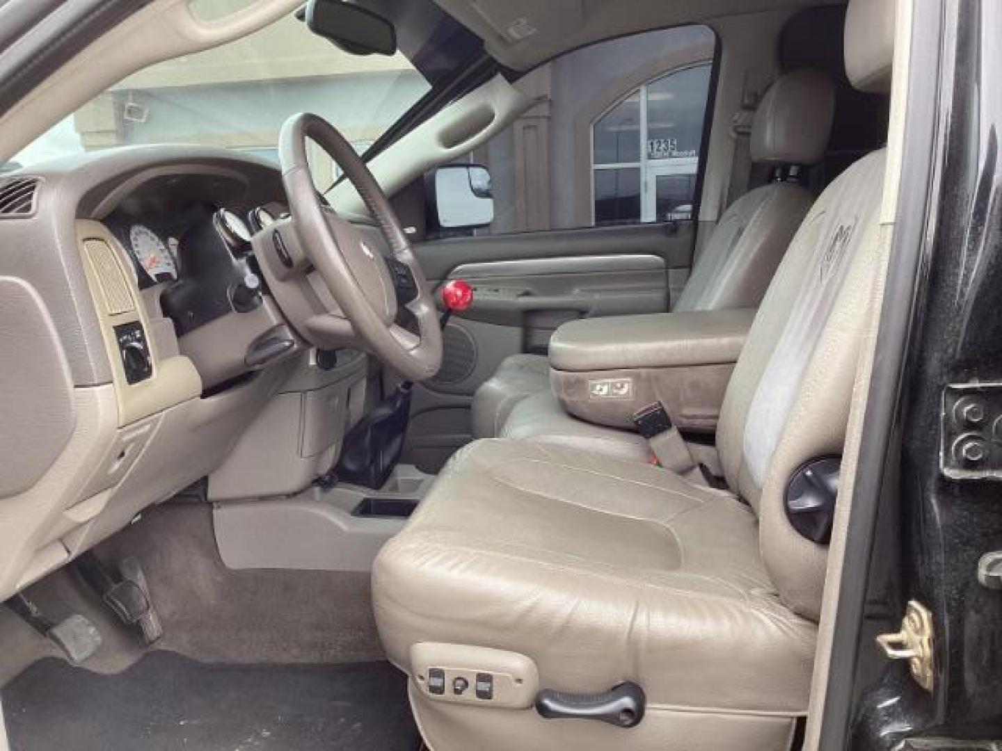 2004 Black /Dark Slate Gray Leather Interior Dodge Ram 2500 Laramie Quad Cab 4WD (3D7KU28C44G) with an 5.9L L6 OHV 24V TURBO DIESEL engine, 5-Speed Manual transmission, located at 1235 N Woodruff Ave., Idaho Falls, 83401, (208) 523-1053, 43.507172, -112.000488 - Photo#9