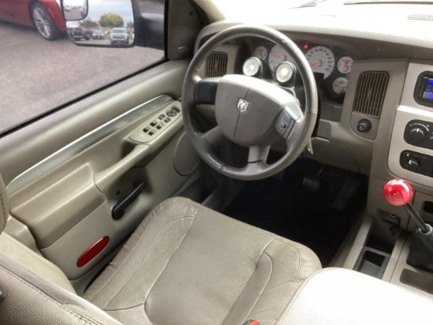 2004 Black /Dark Slate Gray Leather Interior Dodge Ram 2500 Laramie Quad Cab 4WD (3D7KU28C44G) with an 5.9L L6 OHV 24V TURBO DIESEL engine, 5-Speed Manual transmission, located at 1235 N Woodruff Ave., Idaho Falls, 83401, (208) 523-1053, 43.507172, -112.000488 - Photo#13