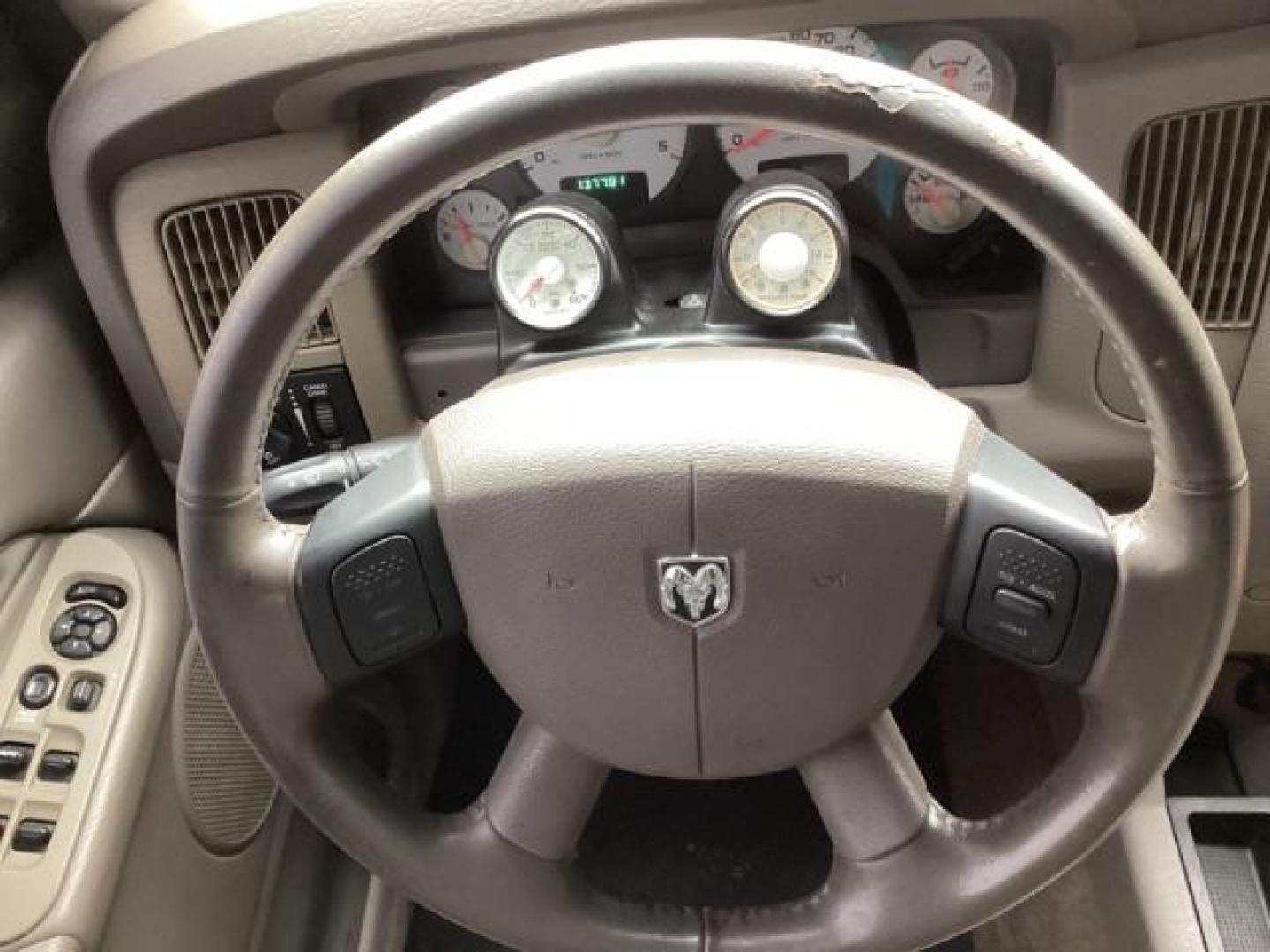 2004 Black /Dark Slate Gray Leather Interior Dodge Ram 2500 Laramie Quad Cab 4WD (3D7KU28C44G) with an 5.9L L6 OHV 24V TURBO DIESEL engine, 5-Speed Manual transmission, located at 1235 N Woodruff Ave., Idaho Falls, 83401, (208) 523-1053, 43.507172, -112.000488 - Photo#16