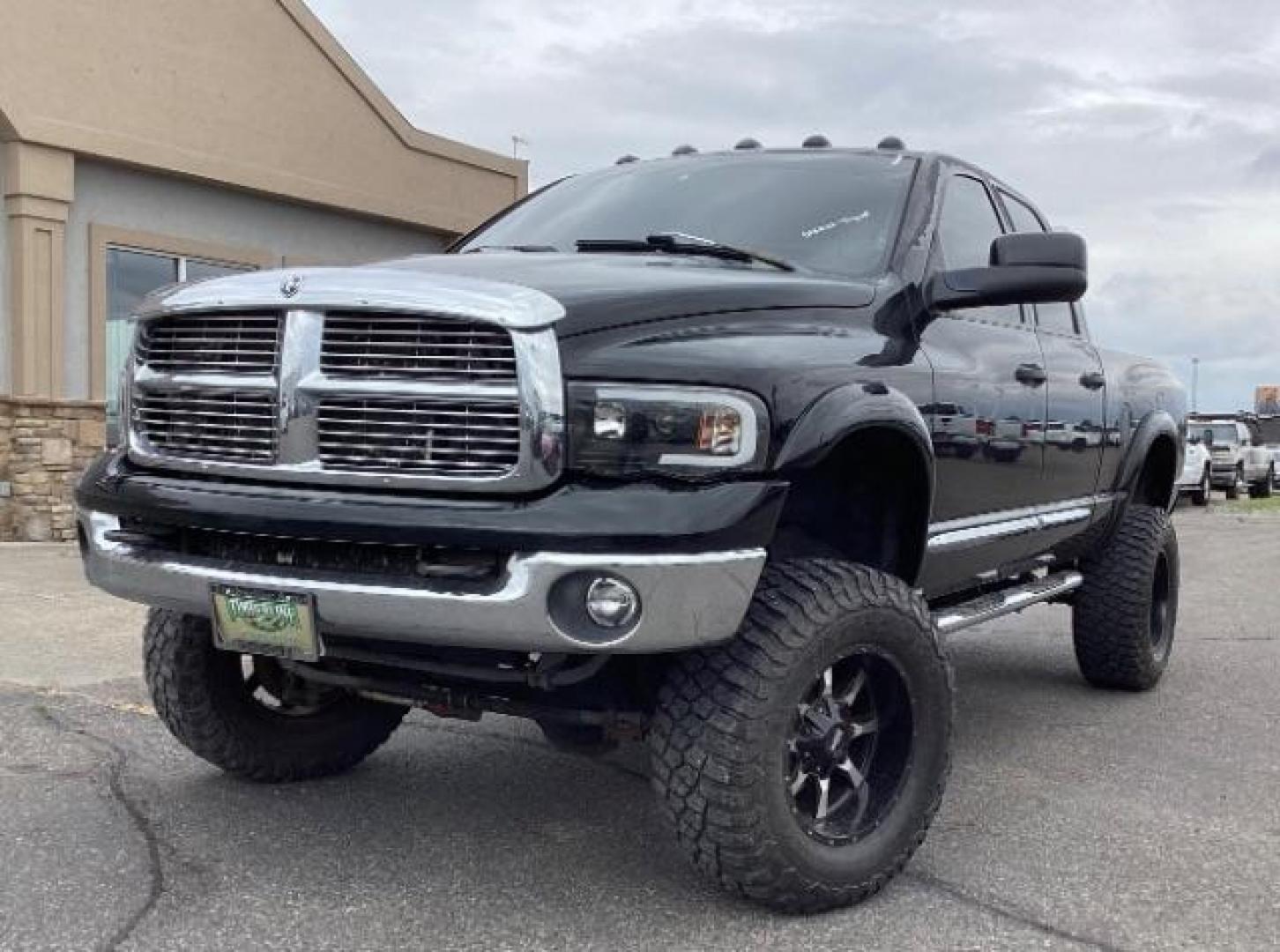 2004 Black /Dark Slate Gray Leather Interior Dodge Ram 2500 Laramie Quad Cab 4WD (3D7KU28C44G) with an 5.9L L6 OHV 24V TURBO DIESEL engine, 5-Speed Manual transmission, located at 1235 N Woodruff Ave., Idaho Falls, 83401, (208) 523-1053, 43.507172, -112.000488 - Photo#1