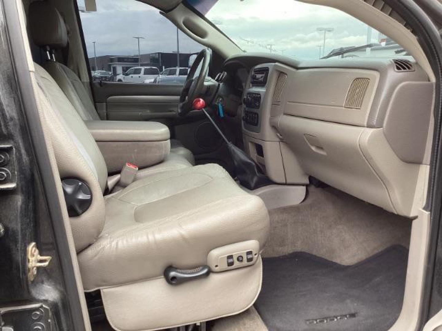 2004 Black /Dark Slate Gray Leather Interior Dodge Ram 2500 Laramie Quad Cab 4WD (3D7KU28C44G) with an 5.9L L6 OHV 24V TURBO DIESEL engine, 5-Speed Manual transmission, located at 1235 N Woodruff Ave., Idaho Falls, 83401, (208) 523-1053, 43.507172, -112.000488 - Photo#26