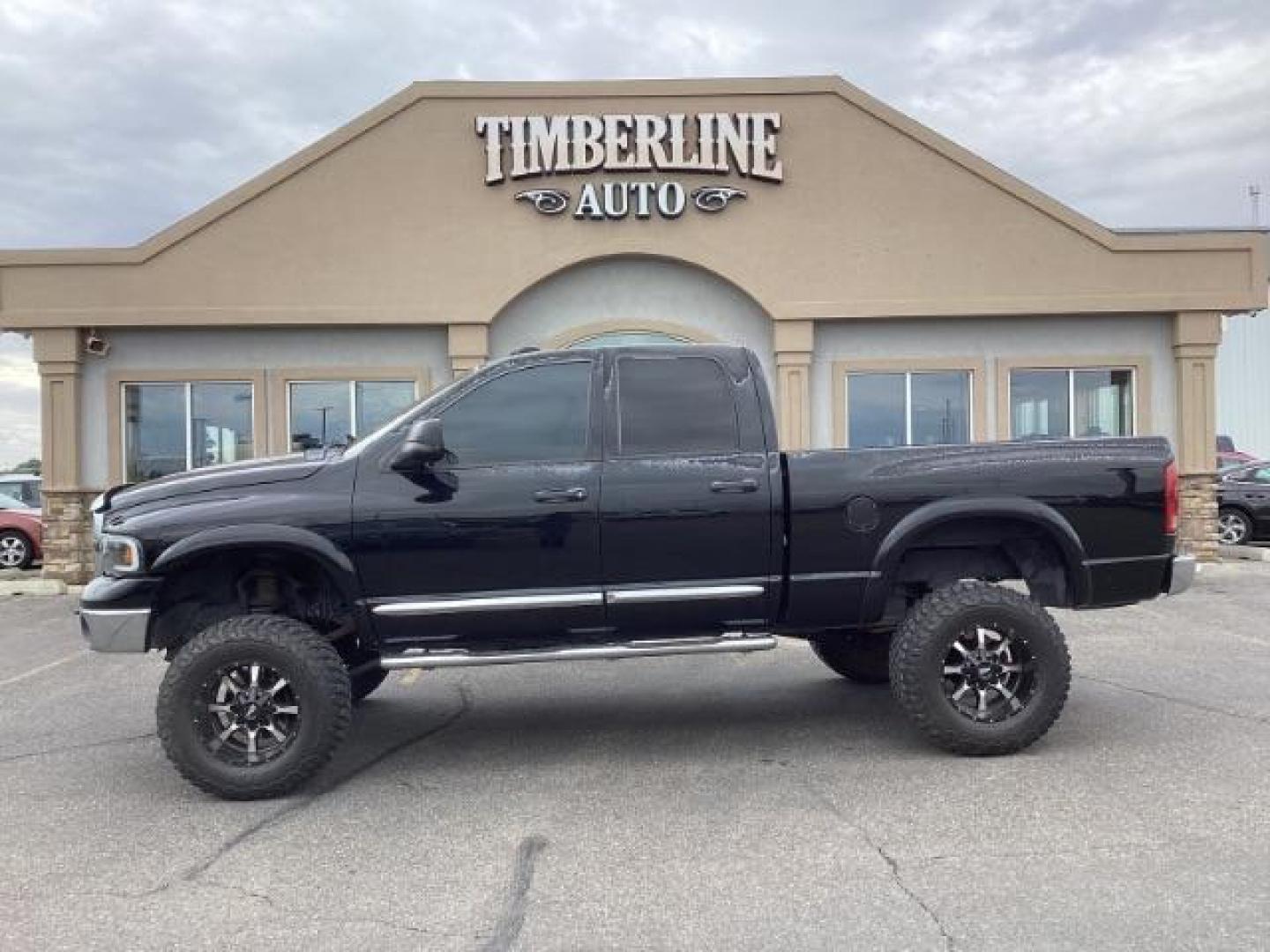 2004 Black /Dark Slate Gray Leather Interior Dodge Ram 2500 Laramie Quad Cab 4WD (3D7KU28C44G) with an 5.9L L6 OHV 24V TURBO DIESEL engine, 5-Speed Manual transmission, located at 1235 N Woodruff Ave., Idaho Falls, 83401, (208) 523-1053, 43.507172, -112.000488 - Photo#2