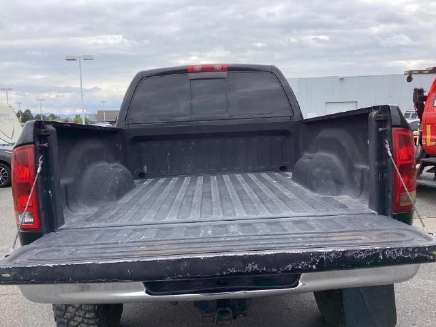 2004 Black /Dark Slate Gray Leather Interior Dodge Ram 2500 Laramie Quad Cab 4WD (3D7KU28C44G) with an 5.9L L6 OHV 24V TURBO DIESEL engine, 5-Speed Manual transmission, located at 1235 N Woodruff Ave., Idaho Falls, 83401, (208) 523-1053, 43.507172, -112.000488 - Photo#29