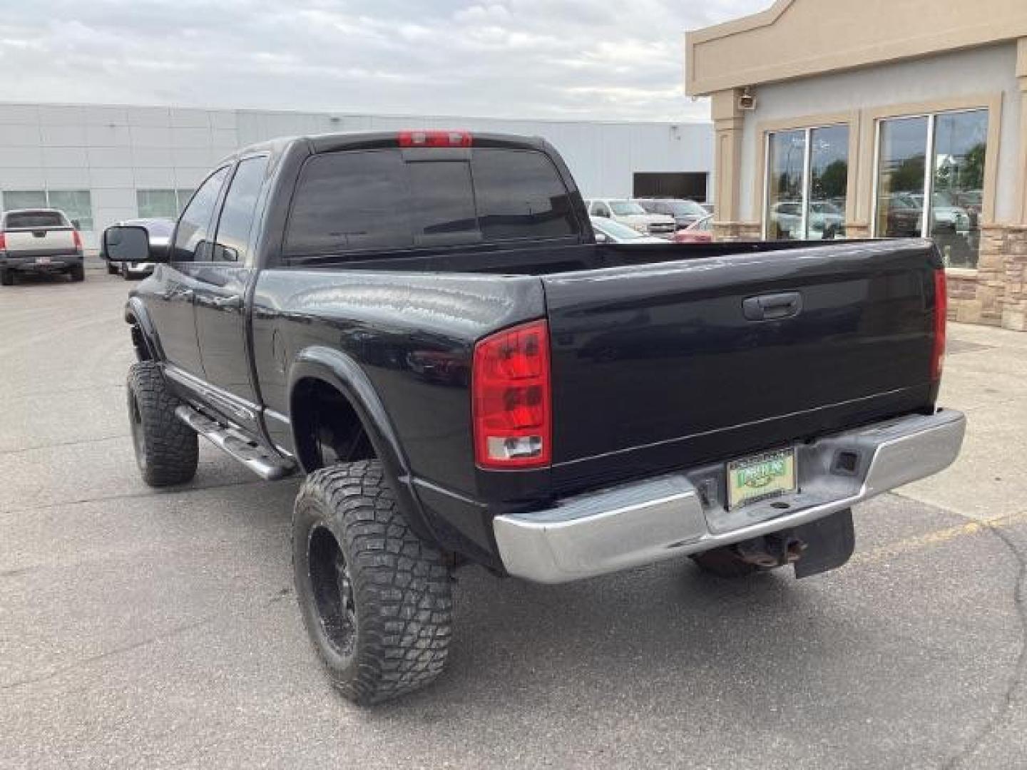 2004 Black /Dark Slate Gray Leather Interior Dodge Ram 2500 Laramie Quad Cab 4WD (3D7KU28C44G) with an 5.9L L6 OHV 24V TURBO DIESEL engine, 5-Speed Manual transmission, located at 1235 N Woodruff Ave., Idaho Falls, 83401, (208) 523-1053, 43.507172, -112.000488 - Photo#3