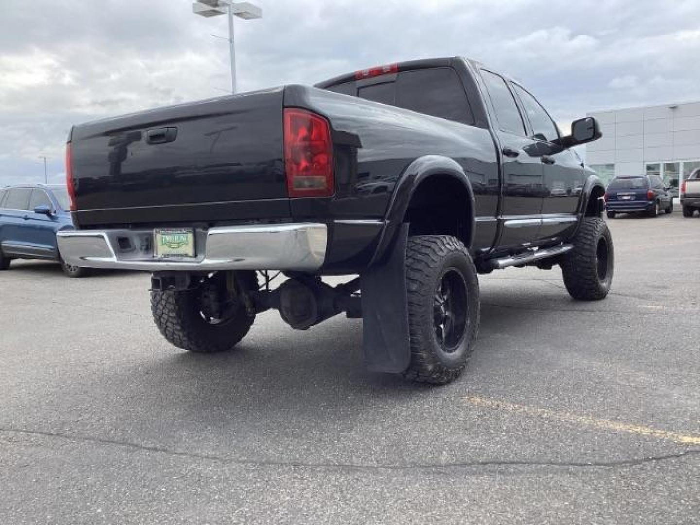 2004 Black /Dark Slate Gray Leather Interior Dodge Ram 2500 Laramie Quad Cab 4WD (3D7KU28C44G) with an 5.9L L6 OHV 24V TURBO DIESEL engine, 5-Speed Manual transmission, located at 1235 N Woodruff Ave., Idaho Falls, 83401, (208) 523-1053, 43.507172, -112.000488 - Photo#5