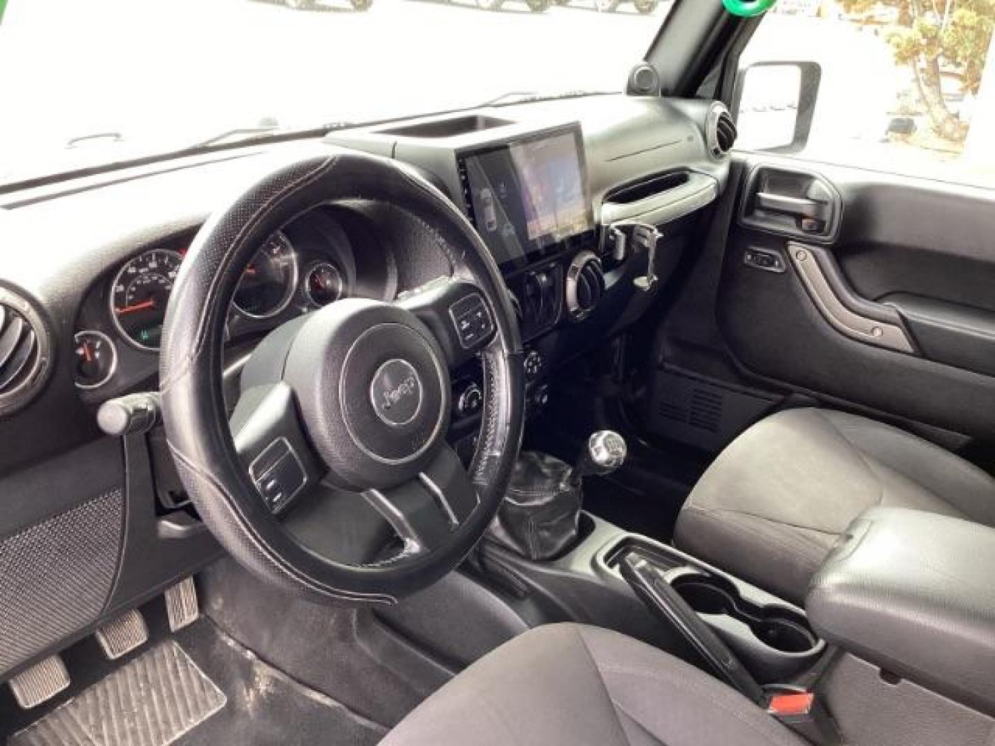 2014 Black Clearcoat Jeep Wrangler Sport 4WD (1C4AJWAG9EL) with an 3.6L V6 DOHC 24V FFV engine, located at 1235 N Woodruff Ave., Idaho Falls, 83401, (208) 523-1053, 43.507172, -112.000488 - Photo#13