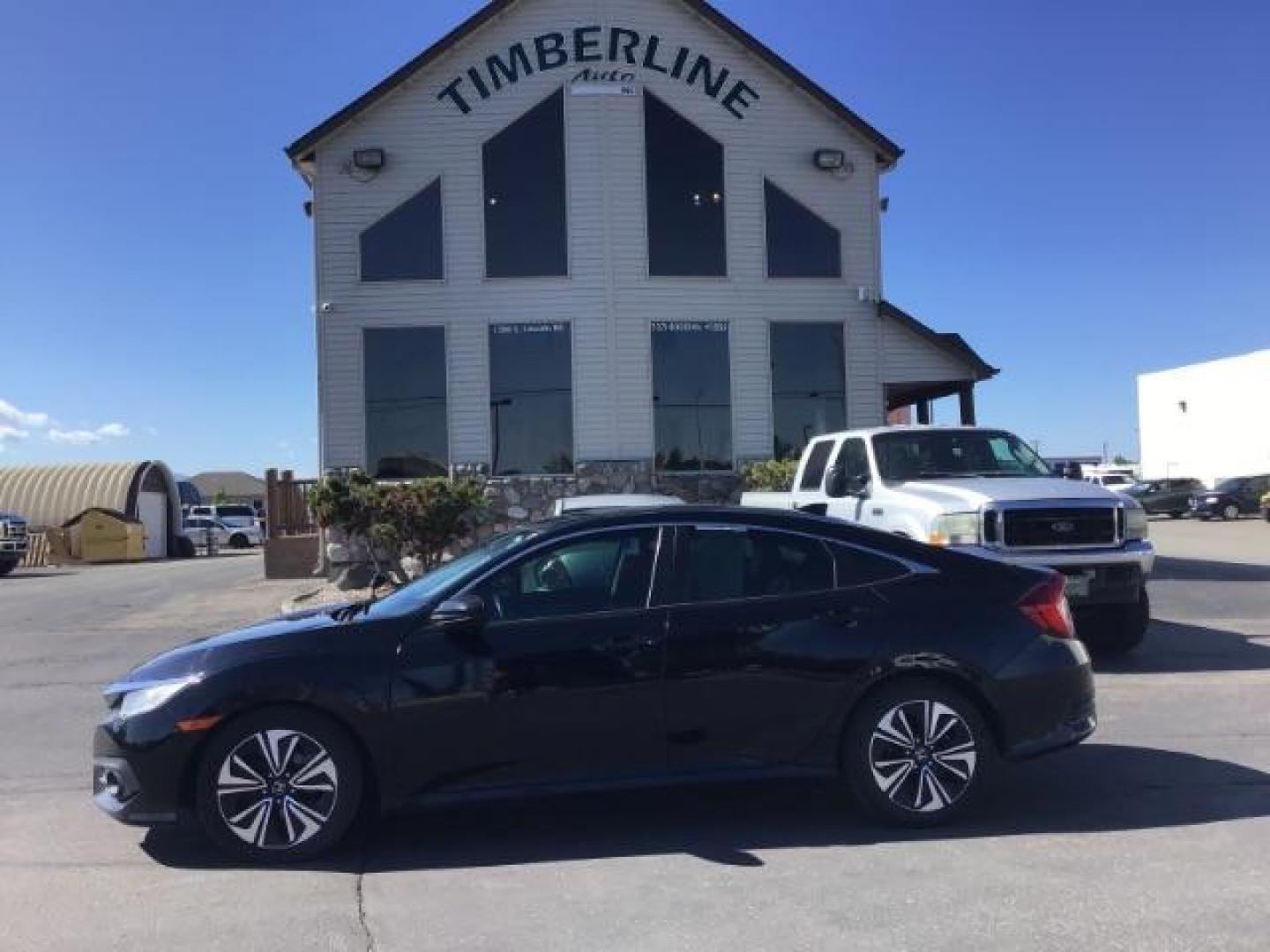 2017 Crystal Black Pearl /Black, leather Honda Civic EX-TL Sedan CVT (19XFC1F78HE) with an 1.5L L4 DOHC 16V TURBO engine, Automatic transmission, located at 1235 N Woodruff Ave., Idaho Falls, 83401, (208) 523-1053, 43.507172, -112.000488 - At Timberline Auto it is always easy to find a great deal on your next vehicle! Our experienced sales staff can help find the right vehicle will fit your needs. Our knowledgeable finance department has options for almost any credit score. We offer many warranty contract options to protect you new pr - Photo#1