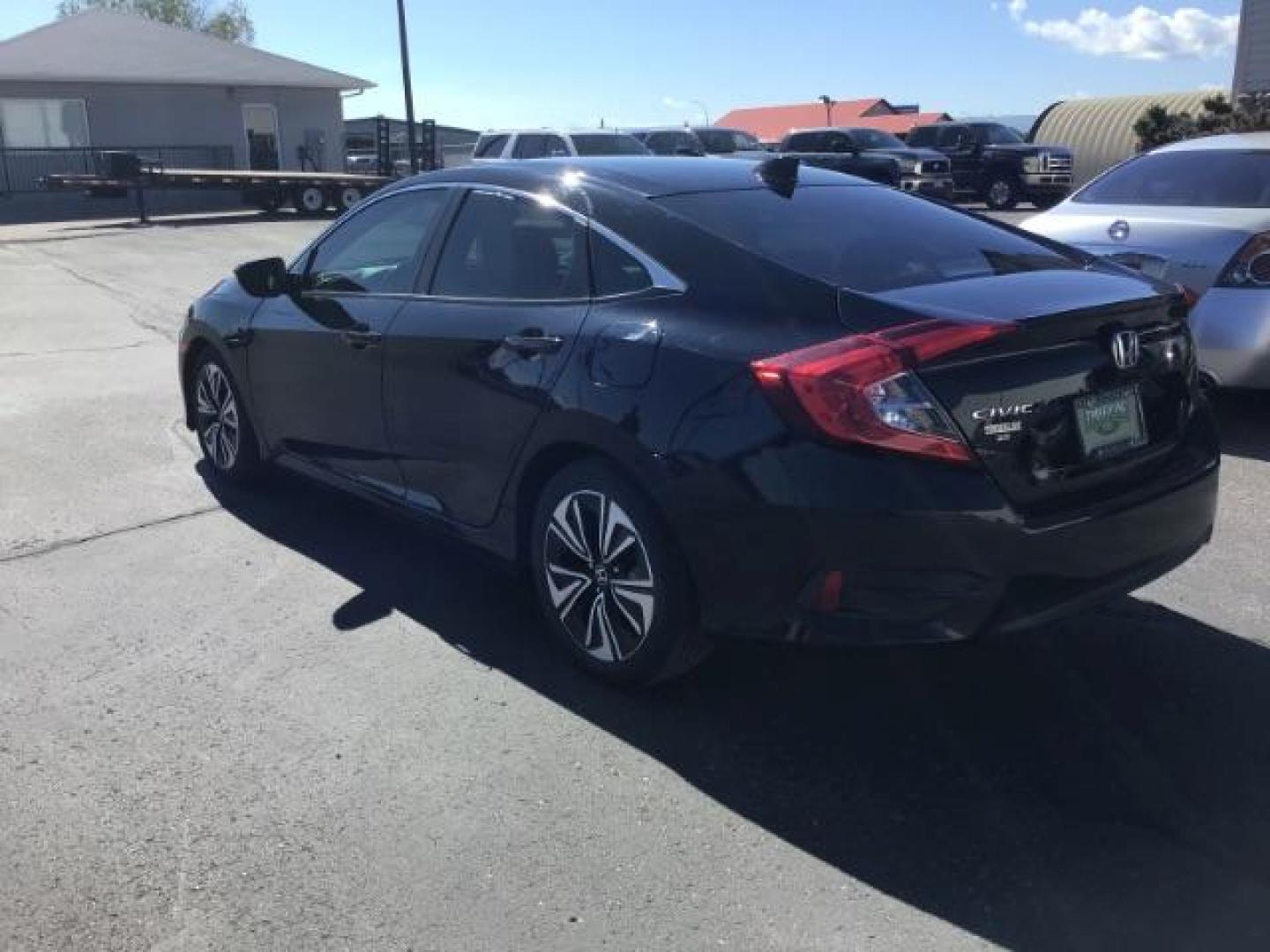 2017 Crystal Black Pearl /Black, leather Honda Civic EX-TL Sedan CVT (19XFC1F78HE) with an 1.5L L4 DOHC 16V TURBO engine, Automatic transmission, located at 1235 N Woodruff Ave., Idaho Falls, 83401, (208) 523-1053, 43.507172, -112.000488 - At Timberline Auto it is always easy to find a great deal on your next vehicle! Our experienced sales staff can help find the right vehicle will fit your needs. Our knowledgeable finance department has options for almost any credit score. We offer many warranty contract options to protect you new pr - Photo#2