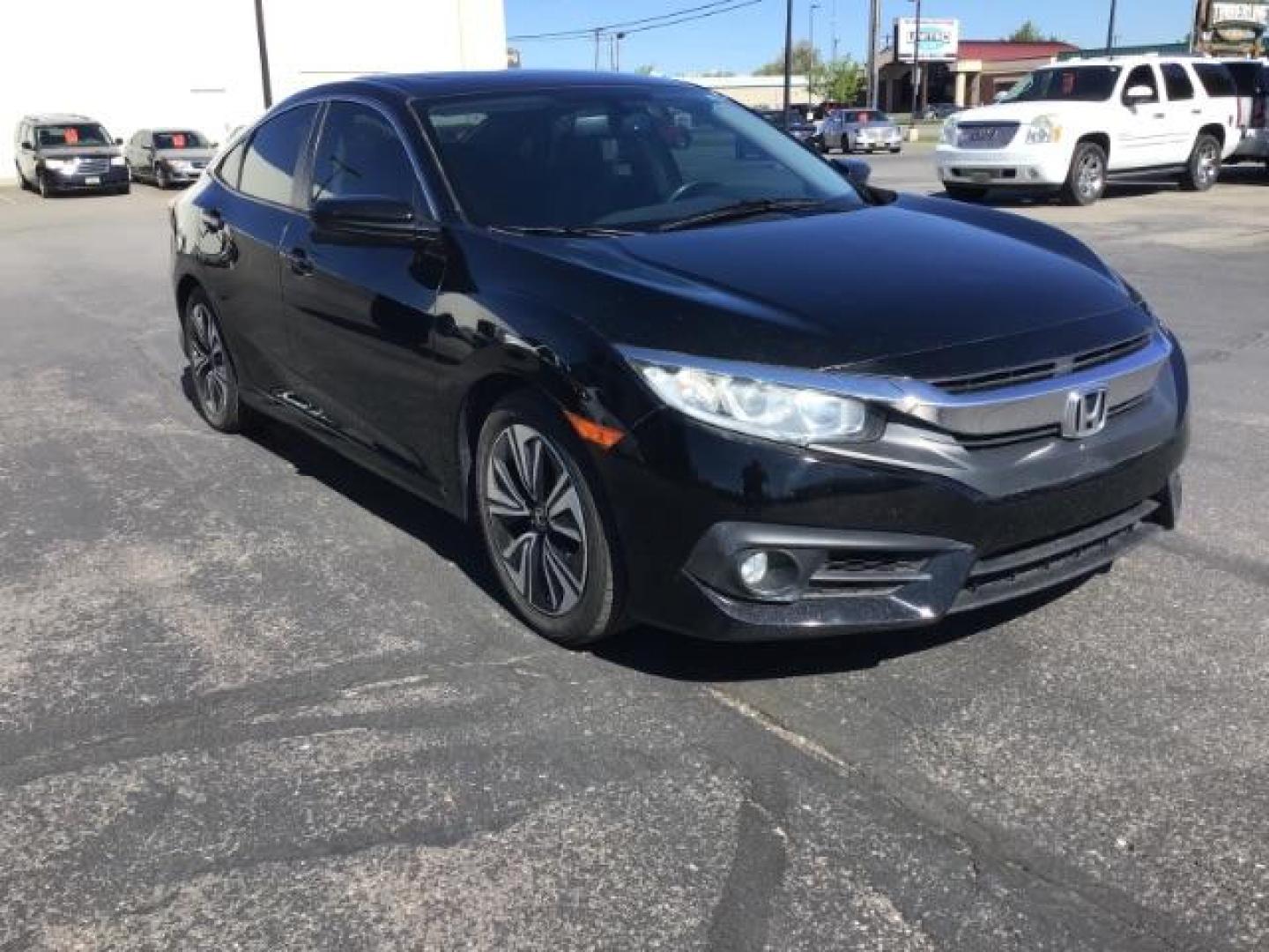 2017 Crystal Black Pearl /Black, leather Honda Civic EX-TL Sedan CVT (19XFC1F78HE) with an 1.5L L4 DOHC 16V TURBO engine, Automatic transmission, located at 1235 N Woodruff Ave., Idaho Falls, 83401, (208) 523-1053, 43.507172, -112.000488 - At Timberline Auto it is always easy to find a great deal on your next vehicle! Our experienced sales staff can help find the right vehicle will fit your needs. Our knowledgeable finance department has options for almost any credit score. We offer many warranty contract options to protect you new pr - Photo#4