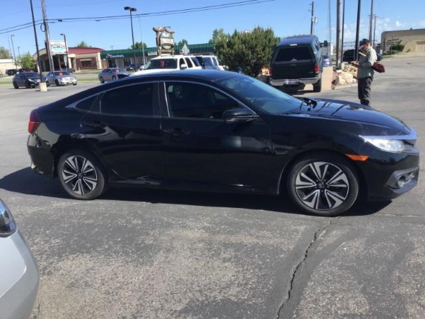 2017 Crystal Black Pearl /Black, leather Honda Civic EX-TL Sedan CVT (19XFC1F78HE) with an 1.5L L4 DOHC 16V TURBO engine, Automatic transmission, located at 1235 N Woodruff Ave., Idaho Falls, 83401, (208) 523-1053, 43.507172, -112.000488 - At Timberline Auto it is always easy to find a great deal on your next vehicle! Our experienced sales staff can help find the right vehicle will fit your needs. Our knowledgeable finance department has options for almost any credit score. We offer many warranty contract options to protect you new pr - Photo#5