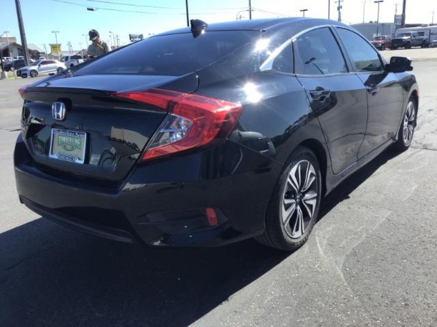 2017 Crystal Black Pearl /Black, leather Honda Civic EX-TL Sedan CVT (19XFC1F78HE) with an 1.5L L4 DOHC 16V TURBO engine, Automatic transmission, located at 1235 N Woodruff Ave., Idaho Falls, 83401, (208) 523-1053, 43.507172, -112.000488 - At Timberline Auto it is always easy to find a great deal on your next vehicle! Our experienced sales staff can help find the right vehicle will fit your needs. Our knowledgeable finance department has options for almost any credit score. We offer many warranty contract options to protect you new pr - Photo#6