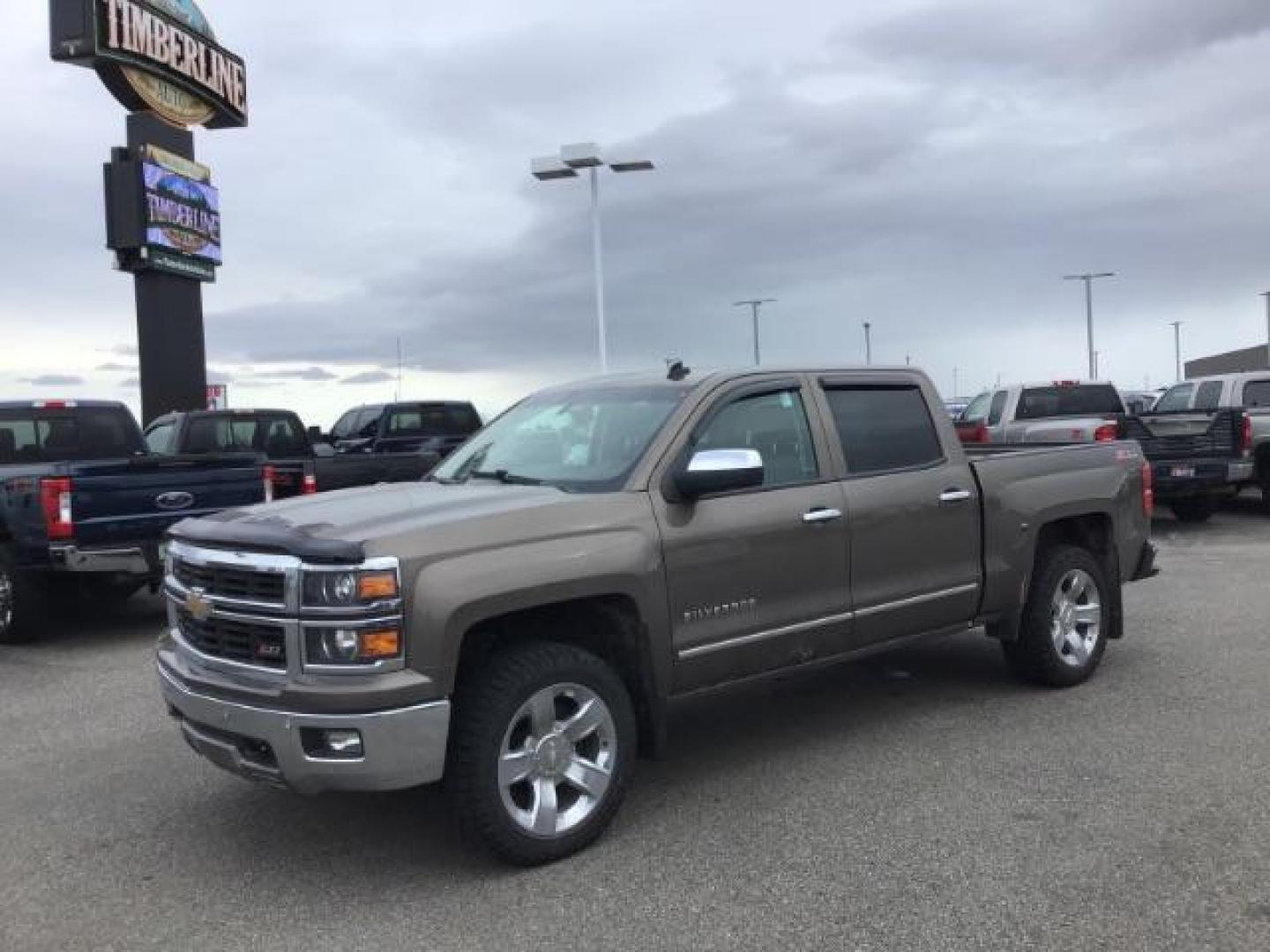 2014 Brownstone Metallic /Cocoa/Dune Chevrolet Silverado 1500 1LZ Crew Cab 4WD (3GCUKSEC1EG) with an 5.3L V8 OHV 16V engine, 6-Speed Automatic transmission, located at 1235 N Woodruff Ave., Idaho Falls, 83401, (208) 523-1053, 43.507172, -112.000488 - This 2014 GMC 1500 4x4, has the 5.3L V8 motor. It has 122,000 miles. It comes with leather seats, power seats, keyless remote, dual power seats, and cruise control. At Timberline Auto it is always easy to find a great deal on your next vehicle! Our experienced sales staff can help find the right veh - Photo#0