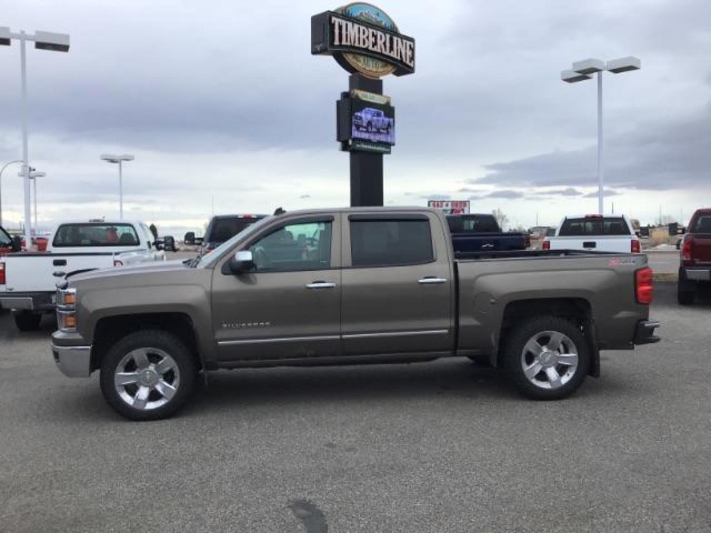 2014 Brownstone Metallic /Cocoa/Dune Chevrolet Silverado 1500 1LZ Crew Cab 4WD (3GCUKSEC1EG) with an 5.3L V8 OHV 16V engine, 6-Speed Automatic transmission, located at 1235 N Woodruff Ave., Idaho Falls, 83401, (208) 523-1053, 43.507172, -112.000488 - This 2014 GMC 1500 4x4, has the 5.3L V8 motor. It has 122,000 miles. It comes with leather seats, power seats, keyless remote, dual power seats, and cruise control. At Timberline Auto it is always easy to find a great deal on your next vehicle! Our experienced sales staff can help find the right veh - Photo#1