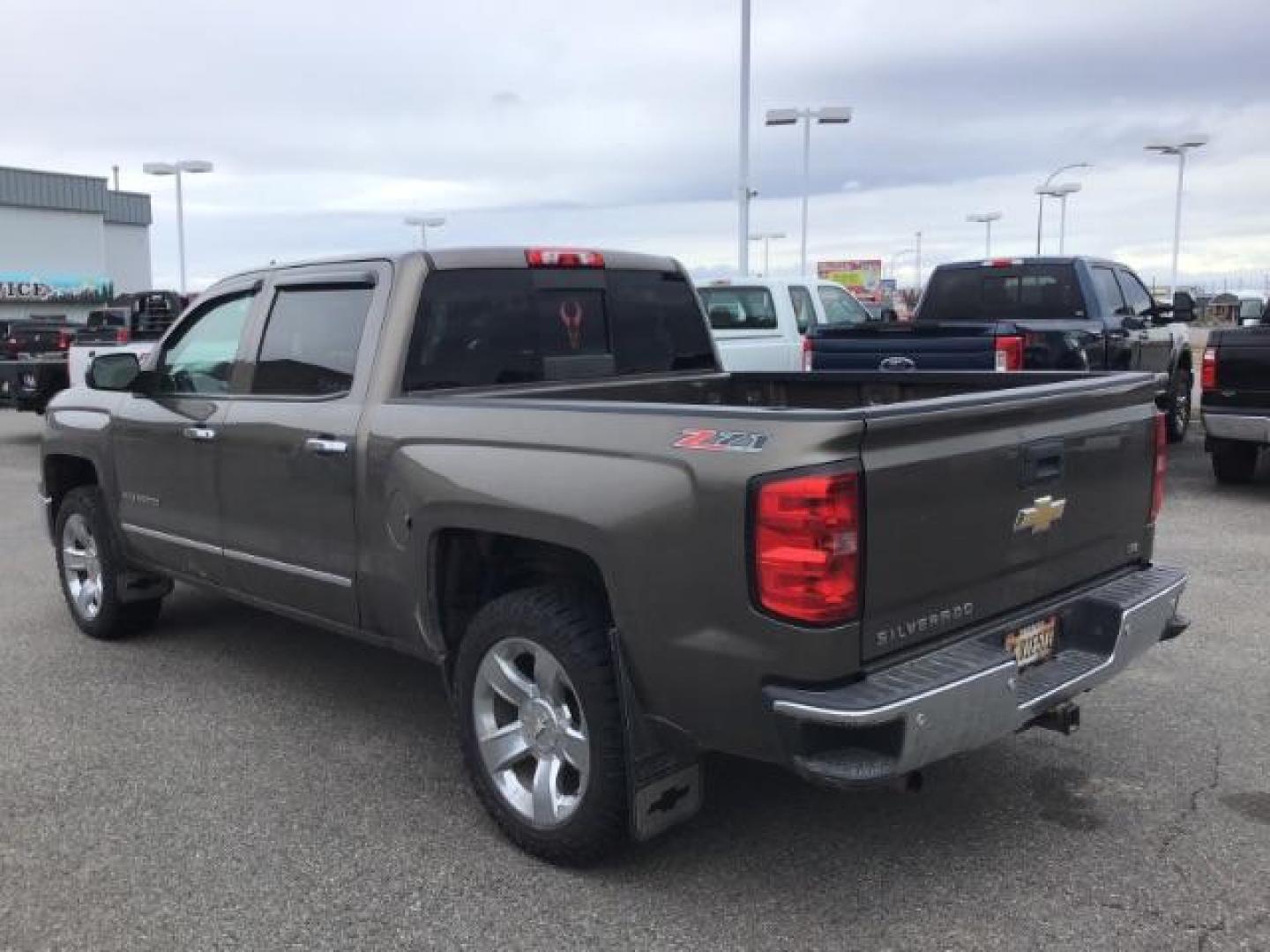 2014 Brownstone Metallic /Cocoa/Dune Chevrolet Silverado 1500 1LZ Crew Cab 4WD (3GCUKSEC1EG) with an 5.3L V8 OHV 16V engine, 6-Speed Automatic transmission, located at 1235 N Woodruff Ave., Idaho Falls, 83401, (208) 523-1053, 43.507172, -112.000488 - This 2014 GMC 1500 4x4, has the 5.3L V8 motor. It has 122,000 miles. It comes with leather seats, power seats, keyless remote, dual power seats, and cruise control. At Timberline Auto it is always easy to find a great deal on your next vehicle! Our experienced sales staff can help find the right veh - Photo#2