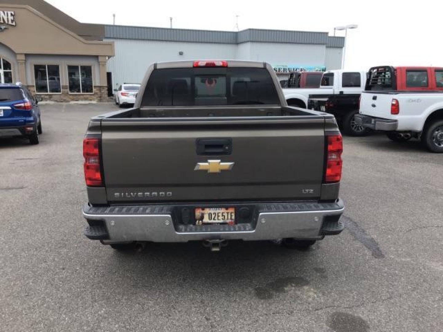 2014 Brownstone Metallic /Cocoa/Dune Chevrolet Silverado 1500 1LZ Crew Cab 4WD (3GCUKSEC1EG) with an 5.3L V8 OHV 16V engine, 6-Speed Automatic transmission, located at 1235 N Woodruff Ave., Idaho Falls, 83401, (208) 523-1053, 43.507172, -112.000488 - This 2014 GMC 1500 4x4, has the 5.3L V8 motor. It has 122,000 miles. It comes with leather seats, power seats, keyless remote, dual power seats, and cruise control. At Timberline Auto it is always easy to find a great deal on your next vehicle! Our experienced sales staff can help find the right veh - Photo#3