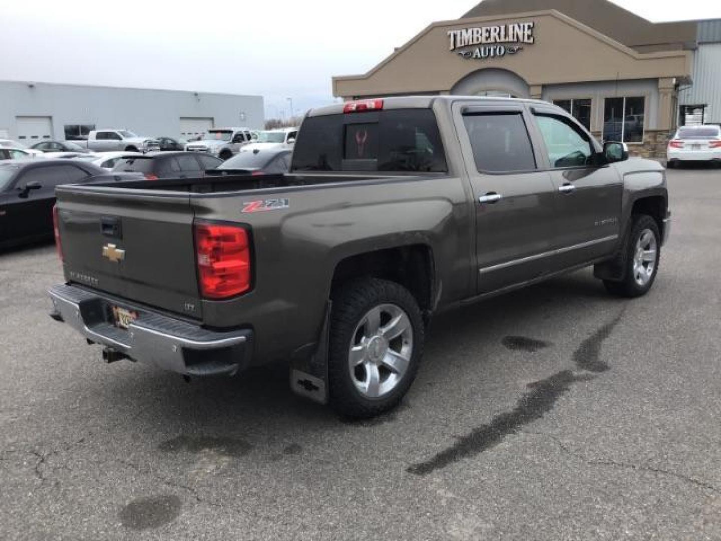 2014 Brownstone Metallic /Cocoa/Dune Chevrolet Silverado 1500 1LZ Crew Cab 4WD (3GCUKSEC1EG) with an 5.3L V8 OHV 16V engine, 6-Speed Automatic transmission, located at 1235 N Woodruff Ave., Idaho Falls, 83401, (208) 523-1053, 43.507172, -112.000488 - This 2014 GMC 1500 4x4, has the 5.3L V8 motor. It has 122,000 miles. It comes with leather seats, power seats, keyless remote, dual power seats, and cruise control. At Timberline Auto it is always easy to find a great deal on your next vehicle! Our experienced sales staff can help find the right veh - Photo#4