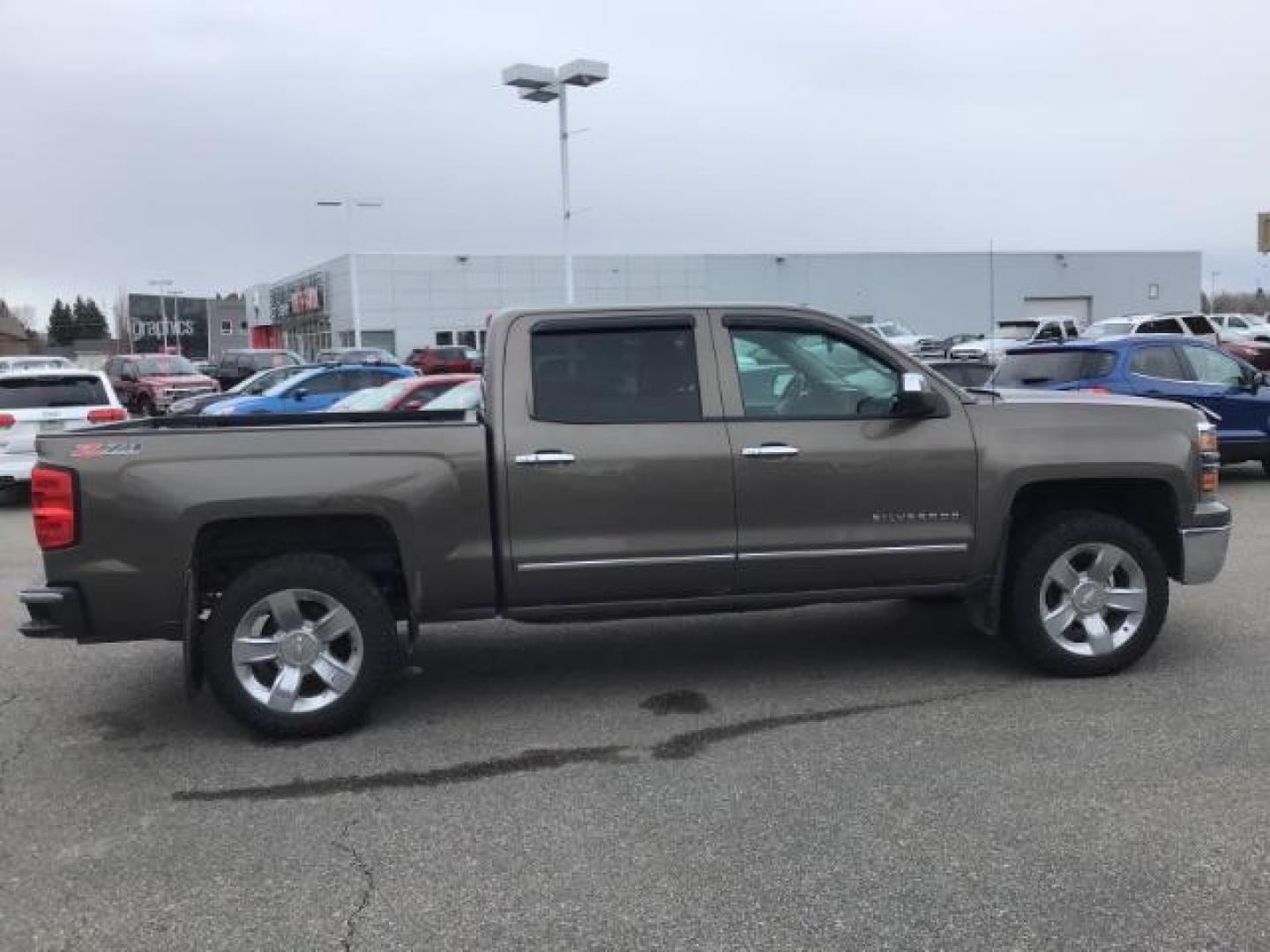 2014 Brownstone Metallic /Cocoa/Dune Chevrolet Silverado 1500 1LZ Crew Cab 4WD (3GCUKSEC1EG) with an 5.3L V8 OHV 16V engine, 6-Speed Automatic transmission, located at 1235 N Woodruff Ave., Idaho Falls, 83401, (208) 523-1053, 43.507172, -112.000488 - This 2014 GMC 1500 4x4, has the 5.3L V8 motor. It has 122,000 miles. It comes with leather seats, power seats, keyless remote, dual power seats, and cruise control. At Timberline Auto it is always easy to find a great deal on your next vehicle! Our experienced sales staff can help find the right veh - Photo#5