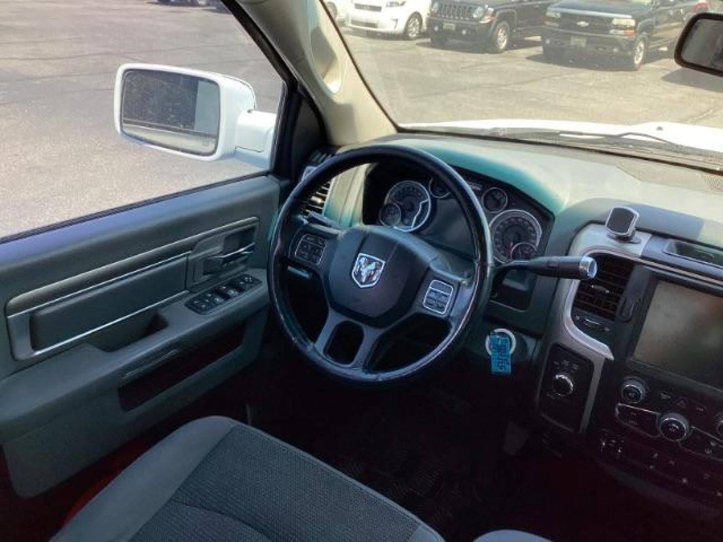 2013 WHITE RAM 1500 SLT Quad Cab 4WD (1C6RR7GTXDS) with an 5.7L V8 OHV 16V engine, 6-Speed Automatic transmission, located at 1235 N Woodruff Ave., Idaho Falls, 83401, (208) 523-1053, 43.507172, -112.000488 - Photo#14