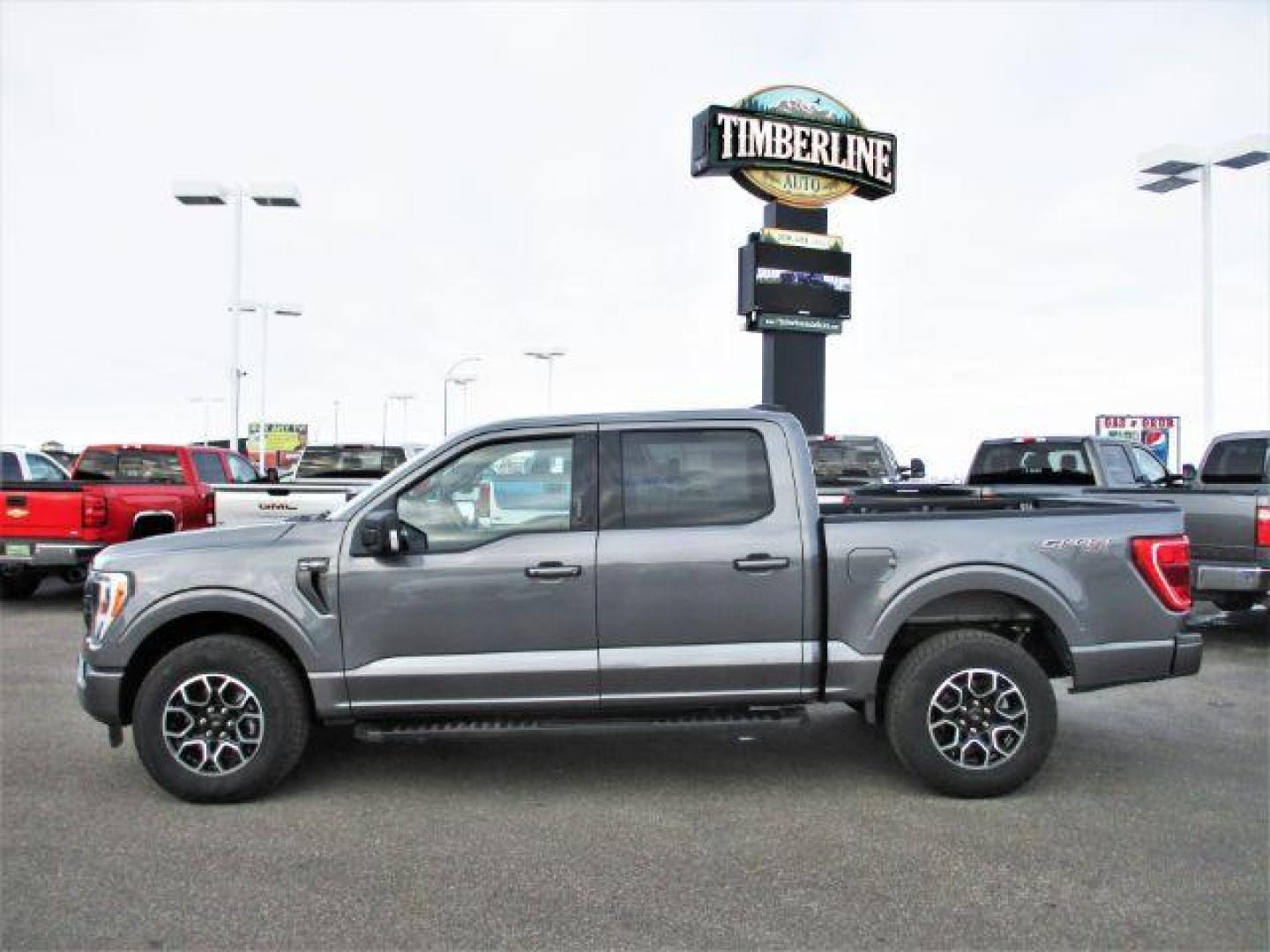 2022 Carbonized Gray Metallic /Black/Medium Dark Slate Ford F-150 Sport SuperCrew 5.5-ft. Bed 4WD (1FTFW1E86NK) with an 3.5L V6 DOHC 24V engine, 10-Speed Automatic transmission, located at 1235 N Woodruff Ave., Idaho Falls, 83401, (208) 523-1053, 43.507172, -112.000488 - Outside you see the factory sport wheels, wide running boards, and color matched bumpers, cloth grey interior with dual power heated seats, large 12 inch touchscreen display offering a high definition back up camera, blind spot monitors, lane assist, remote start, remote tailgate, trailer towing te - Photo#2