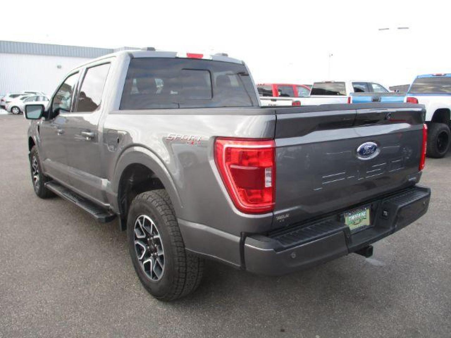 2022 Carbonized Gray Metallic /Black/Medium Dark Slate Ford F-150 Sport SuperCrew 5.5-ft. Bed 4WD (1FTFW1E86NK) with an 3.5L V6 DOHC 24V engine, 10-Speed Automatic transmission, located at 1235 N Woodruff Ave., Idaho Falls, 83401, (208) 523-1053, 43.507172, -112.000488 - Outside you see the factory sport wheels, wide running boards, and color matched bumpers, cloth grey interior with dual power heated seats, large 12 inch touchscreen display offering a high definition back up camera, blind spot monitors, lane assist, remote start, remote tailgate, trailer towing te - Photo#3