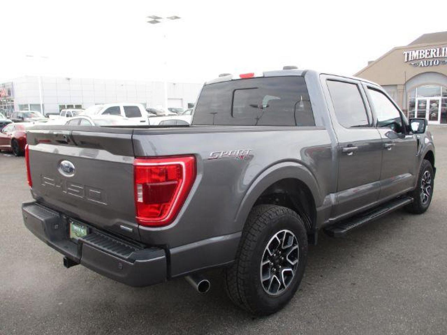 2022 Carbonized Gray Metallic /Black/Medium Dark Slate Ford F-150 Sport SuperCrew 5.5-ft. Bed 4WD (1FTFW1E86NK) with an 3.5L V6 DOHC 24V engine, 10-Speed Automatic transmission, located at 1235 N Woodruff Ave., Idaho Falls, 83401, (208) 523-1053, 43.507172, -112.000488 - Outside you see the factory sport wheels, wide running boards, and color matched bumpers, cloth grey interior with dual power heated seats, large 12 inch touchscreen display offering a high definition back up camera, blind spot monitors, lane assist, remote start, remote tailgate, trailer towing te - Photo#5