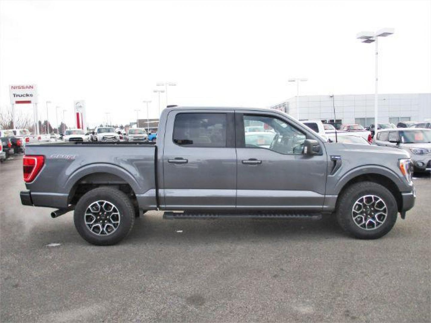 2022 Carbonized Gray Metallic /Black/Medium Dark Slate Ford F-150 Sport SuperCrew 5.5-ft. Bed 4WD (1FTFW1E86NK) with an 3.5L V6 DOHC 24V engine, 10-Speed Automatic transmission, located at 1235 N Woodruff Ave., Idaho Falls, 83401, (208) 523-1053, 43.507172, -112.000488 - Outside you see the factory sport wheels, wide running boards, and color matched bumpers, cloth grey interior with dual power heated seats, large 12 inch touchscreen display offering a high definition back up camera, blind spot monitors, lane assist, remote start, remote tailgate, trailer towing te - Photo#6