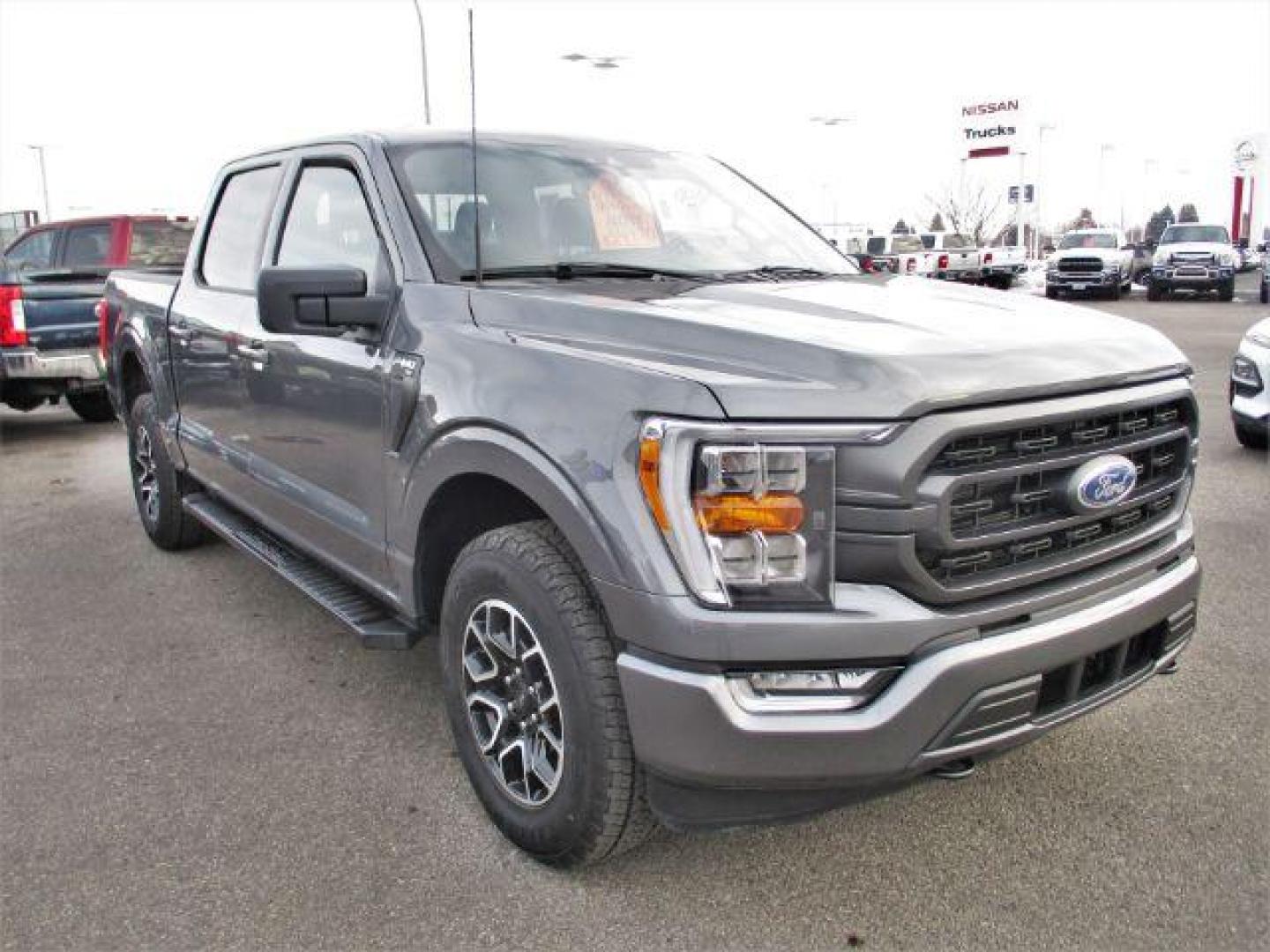 2022 Carbonized Gray Metallic /Black/Medium Dark Slate Ford F-150 Sport SuperCrew 5.5-ft. Bed 4WD (1FTFW1E86NK) with an 3.5L V6 DOHC 24V engine, 10-Speed Automatic transmission, located at 1235 N Woodruff Ave., Idaho Falls, 83401, (208) 523-1053, 43.507172, -112.000488 - Outside you see the factory sport wheels, wide running boards, and color matched bumpers, cloth grey interior with dual power heated seats, large 12 inch touchscreen display offering a high definition back up camera, blind spot monitors, lane assist, remote start, remote tailgate, trailer towing te - Photo#7