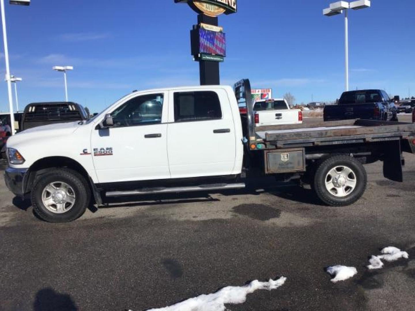 2014 WHITE /WHITE RAM 2500 ST Crew Cab LWB 4WD (3C6UR5HL1EG) with an 6.7L L6 OHV 24V TURBO DIESEL engine, 6-Speed Automatic transmission, located at 1235 N Woodruff Ave., Idaho Falls, 83401, (208) 523-1053, 43.507172, -112.000488 - This 2014 Ram 2500 SLT, has the 6.7L diesel motor. It has 189,551 miles. it has a flat bed. It is a mega cab. It has AM/FM CD stereo, power door looks, power windows, and 4x4. At Timberline Auto it is always easy to find a great deal on your next vehicle! Our experienced sales staff can help find t - Photo#1