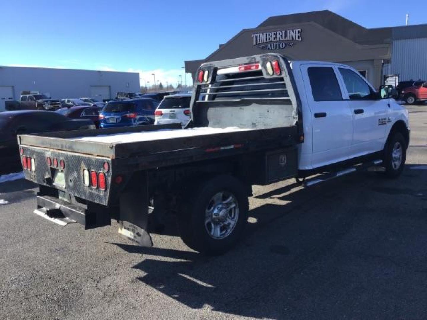 2014 WHITE /WHITE RAM 2500 ST Crew Cab LWB 4WD (3C6UR5HL1EG) with an 6.7L L6 OHV 24V TURBO DIESEL engine, 6-Speed Automatic transmission, located at 1235 N Woodruff Ave., Idaho Falls, 83401, (208) 523-1053, 43.507172, -112.000488 - This 2014 Ram 2500 SLT, has the 6.7L diesel motor. It has 189,551 miles. it has a flat bed. It is a mega cab. It has AM/FM CD stereo, power door looks, power windows, and 4x4. At Timberline Auto it is always easy to find a great deal on your next vehicle! Our experienced sales staff can help find t - Photo#4