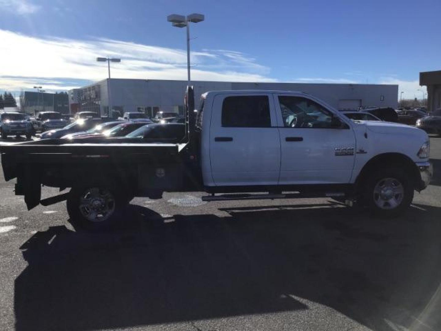 2014 WHITE /WHITE RAM 2500 ST Crew Cab LWB 4WD (3C6UR5HL1EG) with an 6.7L L6 OHV 24V TURBO DIESEL engine, 6-Speed Automatic transmission, located at 1235 N Woodruff Ave., Idaho Falls, 83401, (208) 523-1053, 43.507172, -112.000488 - This 2014 Ram 2500 SLT, has the 6.7L diesel motor. It has 189,551 miles. it has a flat bed. It is a mega cab. It has AM/FM CD stereo, power door looks, power windows, and 4x4. At Timberline Auto it is always easy to find a great deal on your next vehicle! Our experienced sales staff can help find t - Photo#5