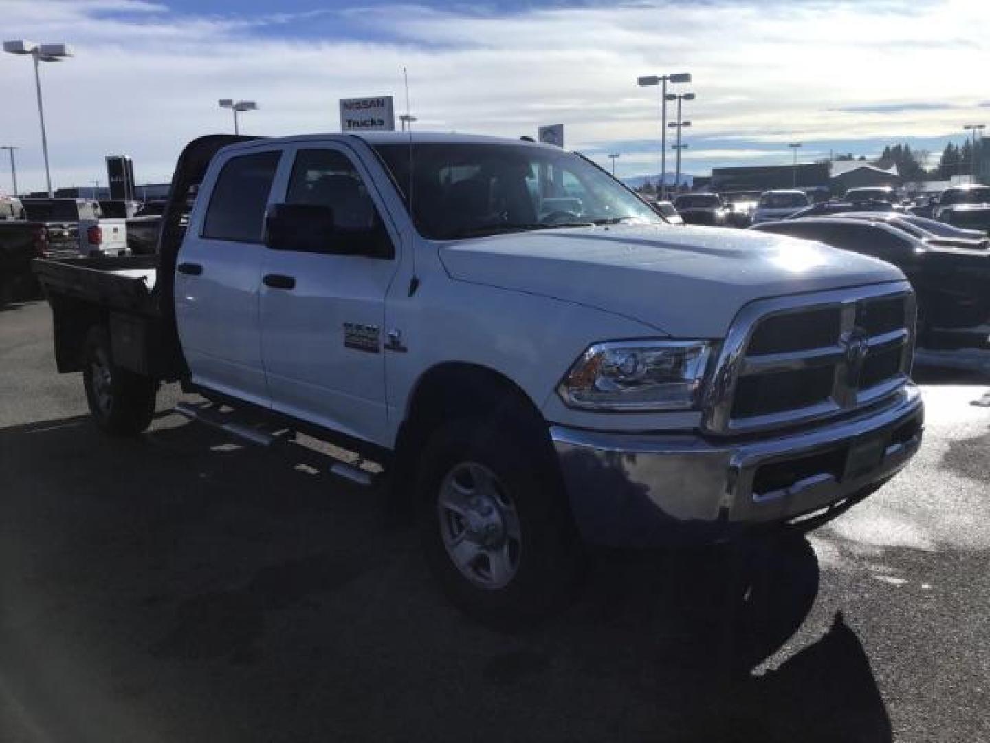 2014 WHITE /WHITE RAM 2500 ST Crew Cab LWB 4WD (3C6UR5HL1EG) with an 6.7L L6 OHV 24V TURBO DIESEL engine, 6-Speed Automatic transmission, located at 1235 N Woodruff Ave., Idaho Falls, 83401, (208) 523-1053, 43.507172, -112.000488 - This 2014 Ram 2500 SLT, has the 6.7L diesel motor. It has 189,551 miles. it has a flat bed. It is a mega cab. It has AM/FM CD stereo, power door looks, power windows, and 4x4. At Timberline Auto it is always easy to find a great deal on your next vehicle! Our experienced sales staff can help find t - Photo#6