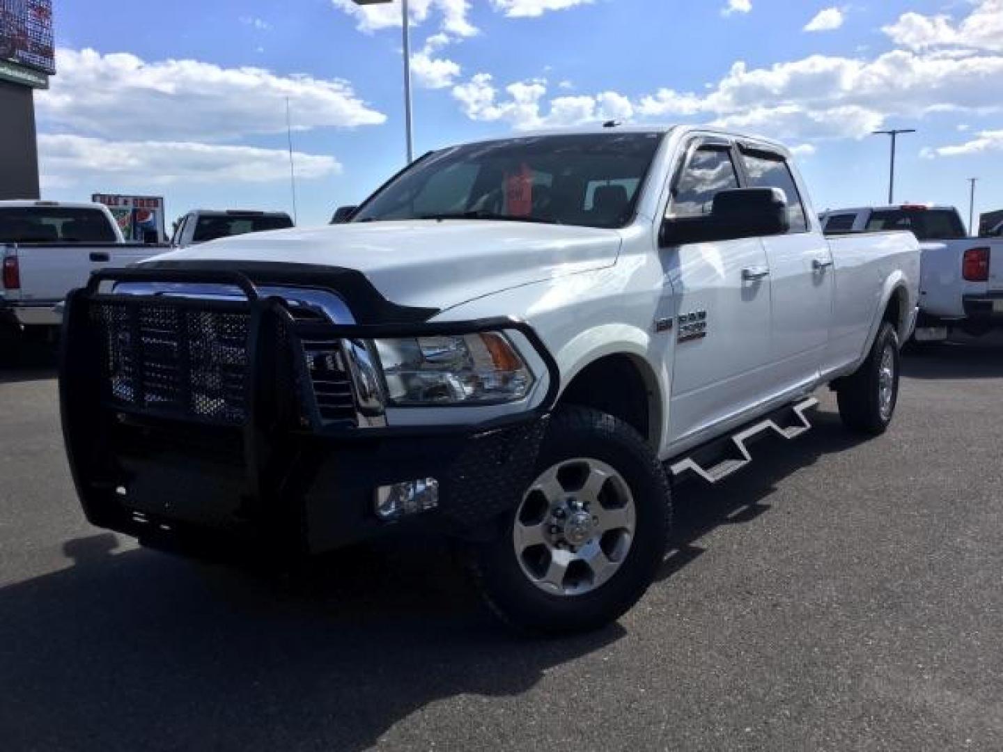 2017 Bright White Clear Coat /Black/Diesel Gray, premium cloth RAM 2500 SLT Crew Cab LWB 4WD (3C6UR5JJ7HG) with an 6.4L V8 engine, 6-Speed Automatic transmission, located at 1235 N Woodruff Ave., Idaho Falls, 83401, (208) 523-1053, 43.507172, -112.000488 - Here's your new pre-owned three-quarter ton, gas powered, crew cab, long bed pick up! With the 6.4L HEMI this truck has a max towing capacity of 19,580 lbs! Inside you will see a premium cloth interior capable of seating six people with plenty of comfort features. At Timberline Auto it is always eas - Photo#1