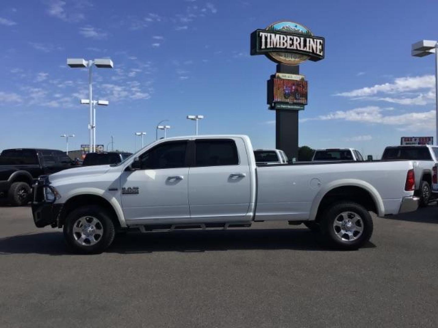 2017 Bright White Clear Coat /Black/Diesel Gray, premium cloth RAM 2500 SLT Crew Cab LWB 4WD (3C6UR5JJ7HG) with an 6.4L V8 engine, 6-Speed Automatic transmission, located at 1235 N Woodruff Ave., Idaho Falls, 83401, (208) 523-1053, 43.507172, -112.000488 - Here's your new pre-owned three-quarter ton, gas powered, crew cab, long bed pick up! With the 6.4L HEMI this truck has a max towing capacity of 19,580 lbs! Inside you will see a premium cloth interior capable of seating six people with plenty of comfort features. At Timberline Auto it is always eas - Photo#2