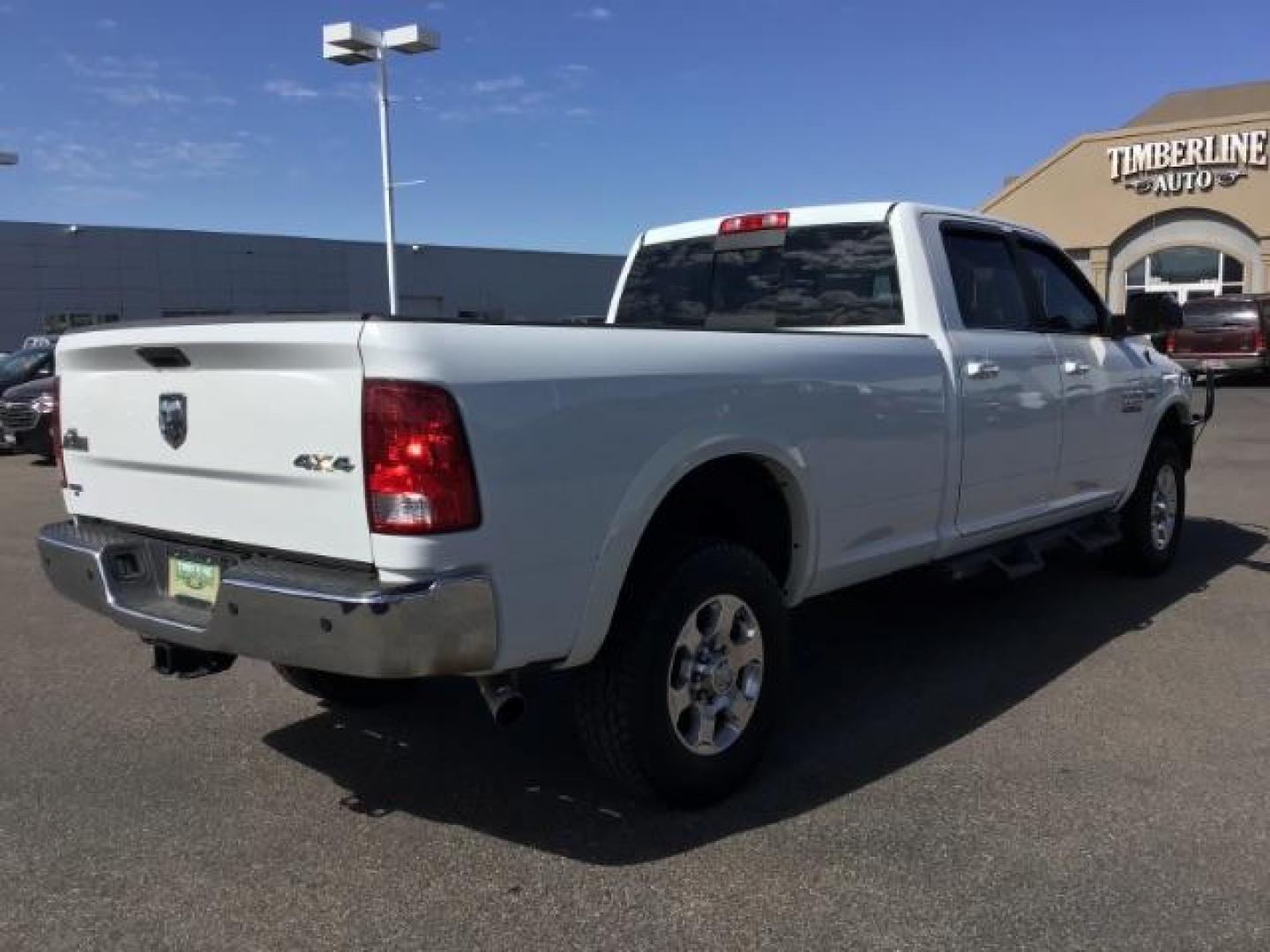 2017 Bright White Clear Coat /Black/Diesel Gray, premium cloth RAM 2500 SLT Crew Cab LWB 4WD (3C6UR5JJ7HG) with an 6.4L V8 engine, 6-Speed Automatic transmission, located at 1235 N Woodruff Ave., Idaho Falls, 83401, (208) 523-1053, 43.507172, -112.000488 - Here's your new pre-owned three-quarter ton, gas powered, crew cab, long bed pick up! With the 6.4L HEMI this truck has a max towing capacity of 19,580 lbs! Inside you will see a premium cloth interior capable of seating six people with plenty of comfort features. At Timberline Auto it is always eas - Photo#5