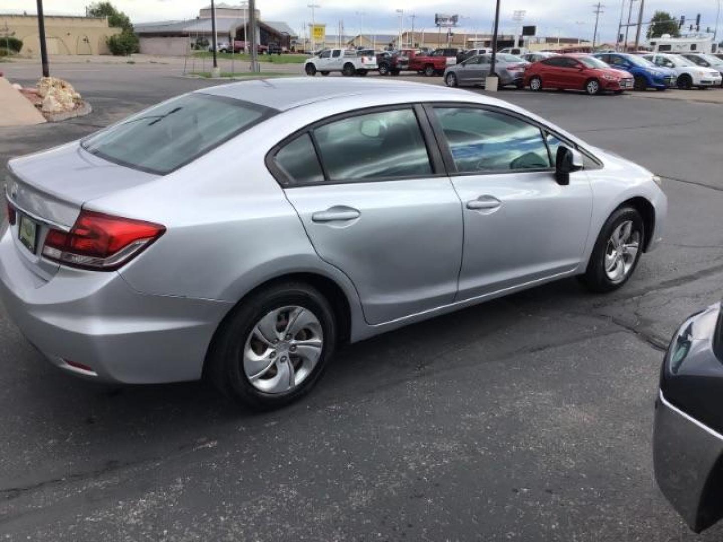 2013 Urban Titanium Metallic /Stone Cloth Interior Honda Civic LX Sedan 5-Speed AT (19XFB2F52DE) with an 1.8L L4 SOHC 16V engine, 5-Speed Automatic transmission, located at 1235 N Woodruff Ave., Idaho Falls, 83401, (208) 523-1053, 43.507172, -112.000488 - At Timberline Auto it is always easy to find a great deal on your next vehicle! Our experienced sales staff can help find the right vehicle will fit your needs. Our knowledgeable finance department has options for almost any credit score. We offer many warranty contract options to protect you new pr - Photo#5