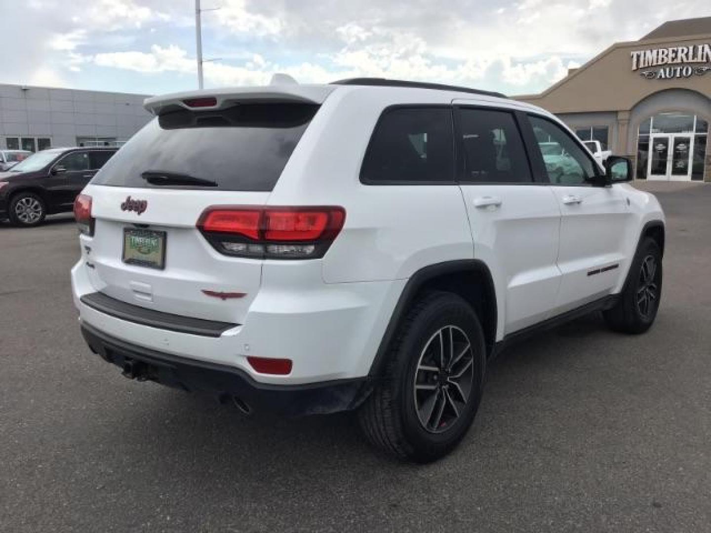 2020 Bright White Clear Coat /Black/Ruby Red, leather Jeep Grand Cherokee Trailhawk 4WD (1C4RJFLG5LC) with an 3.6L V6 DOHC 24V engine, 8-Speed Automatic transmission, located at 1235 N Woodruff Ave., Idaho Falls, 83401, (208) 523-1053, 43.507172, -112.000488 - Leather and loaded, heated and cooled seats, blind spot monitors, AWD, low miles. At Timberline Auto it is always easy to find a great deal on your next vehicle! Our experienced sales staff can help find the right vehicle that will fit your needs. Our knowledgeable finance department has options for - Photo#4