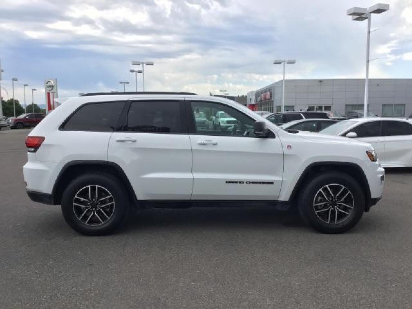 2020 Bright White Clear Coat /Black/Ruby Red, leather Jeep Grand Cherokee Trailhawk 4WD (1C4RJFLG5LC) with an 3.6L V6 DOHC 24V engine, 8-Speed Automatic transmission, located at 1235 N Woodruff Ave., Idaho Falls, 83401, (208) 523-1053, 43.507172, -112.000488 - Leather and loaded, heated and cooled seats, blind spot monitors, AWD, low miles. At Timberline Auto it is always easy to find a great deal on your next vehicle! Our experienced sales staff can help find the right vehicle that will fit your needs. Our knowledgeable finance department has options for - Photo#5